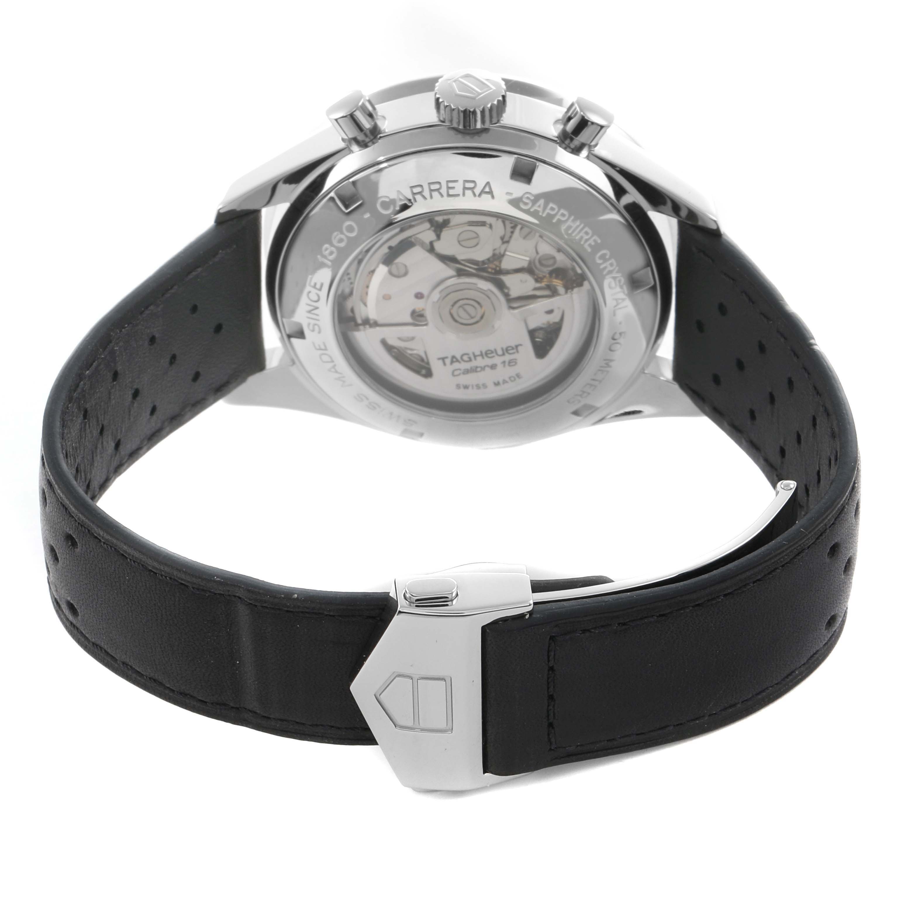 The Tag Heuer Carrera CV2010 Men's Stainless Steel Black Dial watch is shown from the back, highlighting the case back, movement, and leather strap.