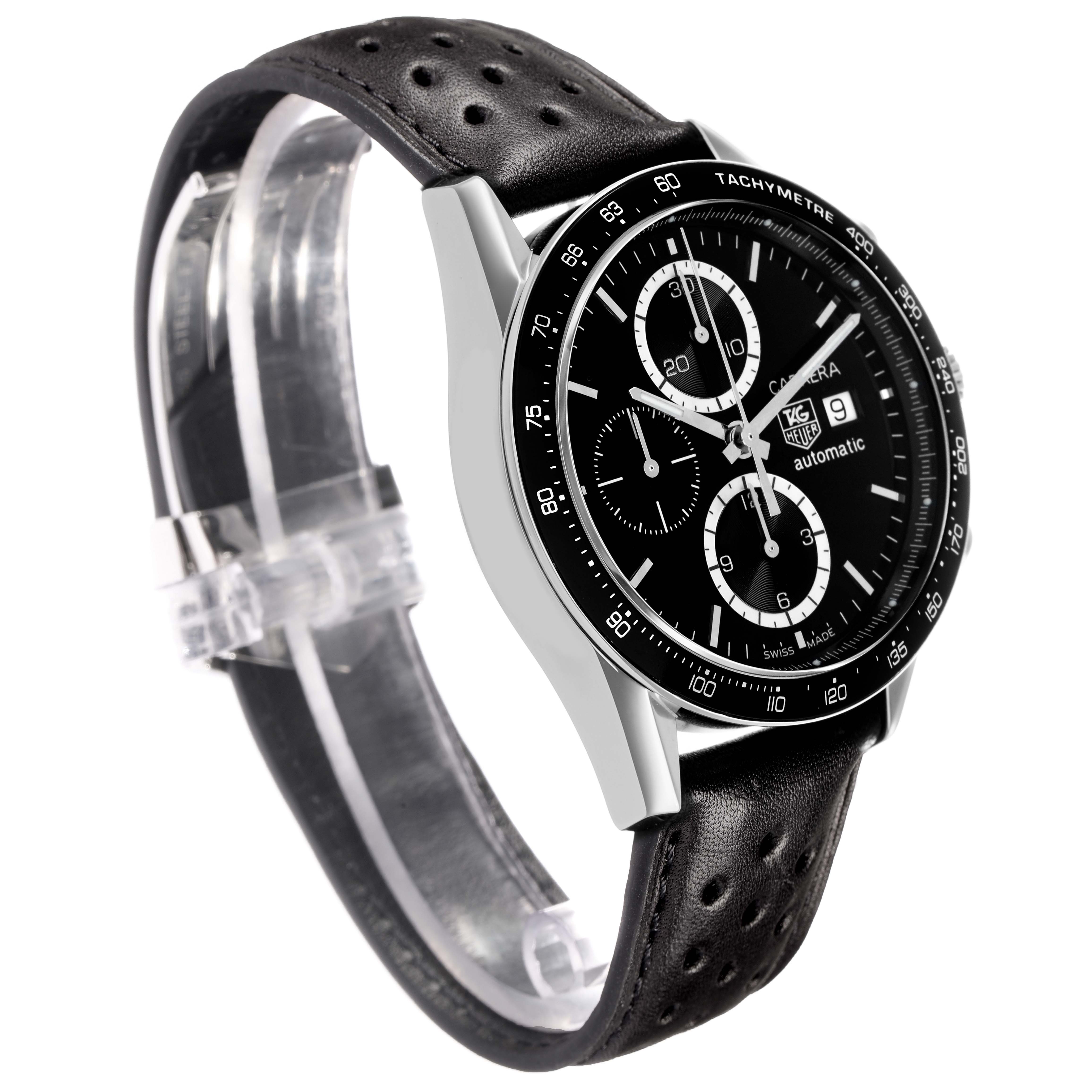 The Tag Heuer Carrera CV2010 Men's Stainless Steel Black Dial watch is shown at an angled side view, displaying its black dial, tachymeter bezel, and perforated leather strap.