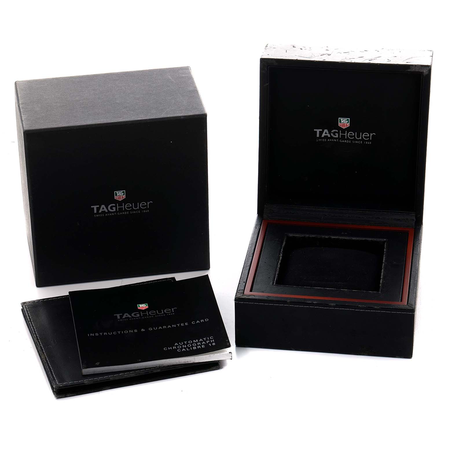 The image shows a TAG Heuer Carrera watch box, booklet, and instruction card from a slightly elevated angle.