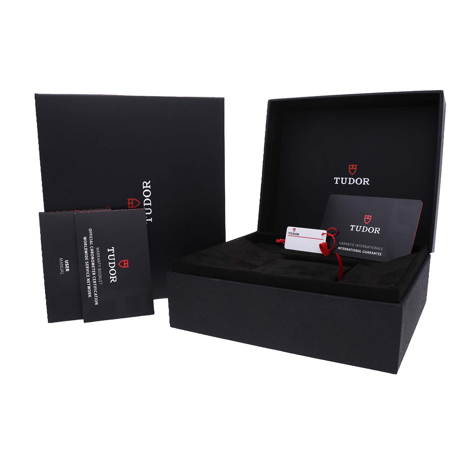 The image shows the packaging and accessories of a Tudor Heritage Black Bay M79360B-0002 Men's Stainless Steel Blue Dial watch, including the box, manuals, and guarantee card.