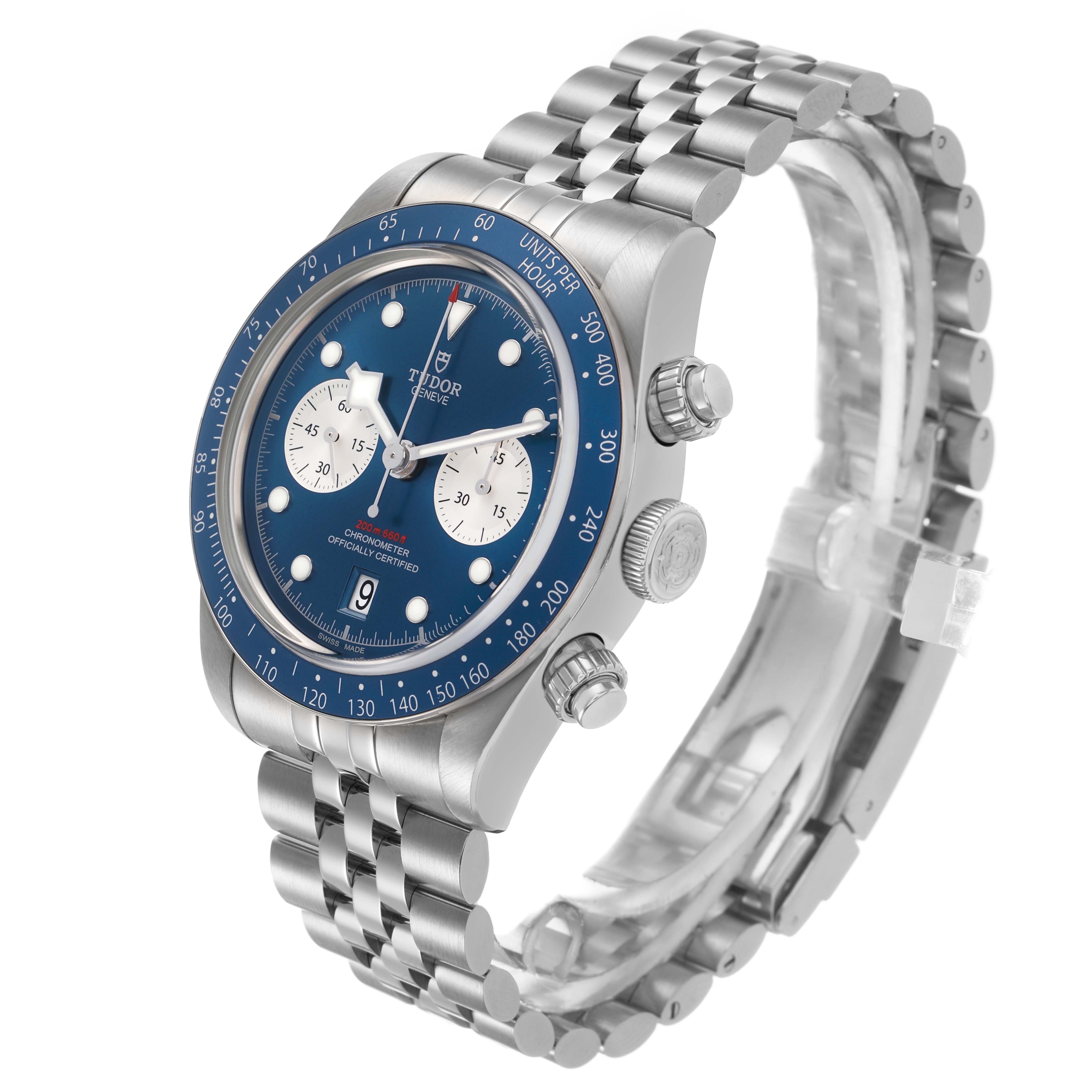 The Tudor Heritage Black Bay M79360B-0002 Men's Stainless Steel Blue Dial watch is shown from a three-quarter angle, displaying the dial, bezel, pushers, crown, and bracelet.
