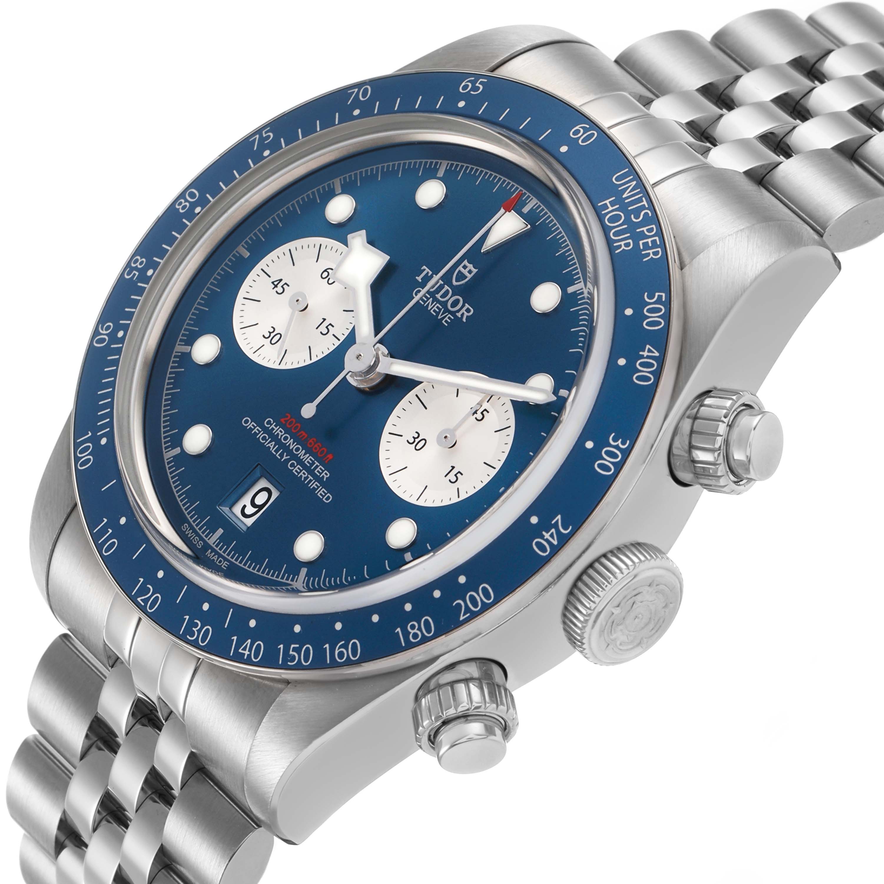 The Tudor Heritage Black Bay M79360B-0002 Men's Stainless Steel Blue Dial watch is shown at an angled side view, displaying its blue bezel, crown, and bracelet.