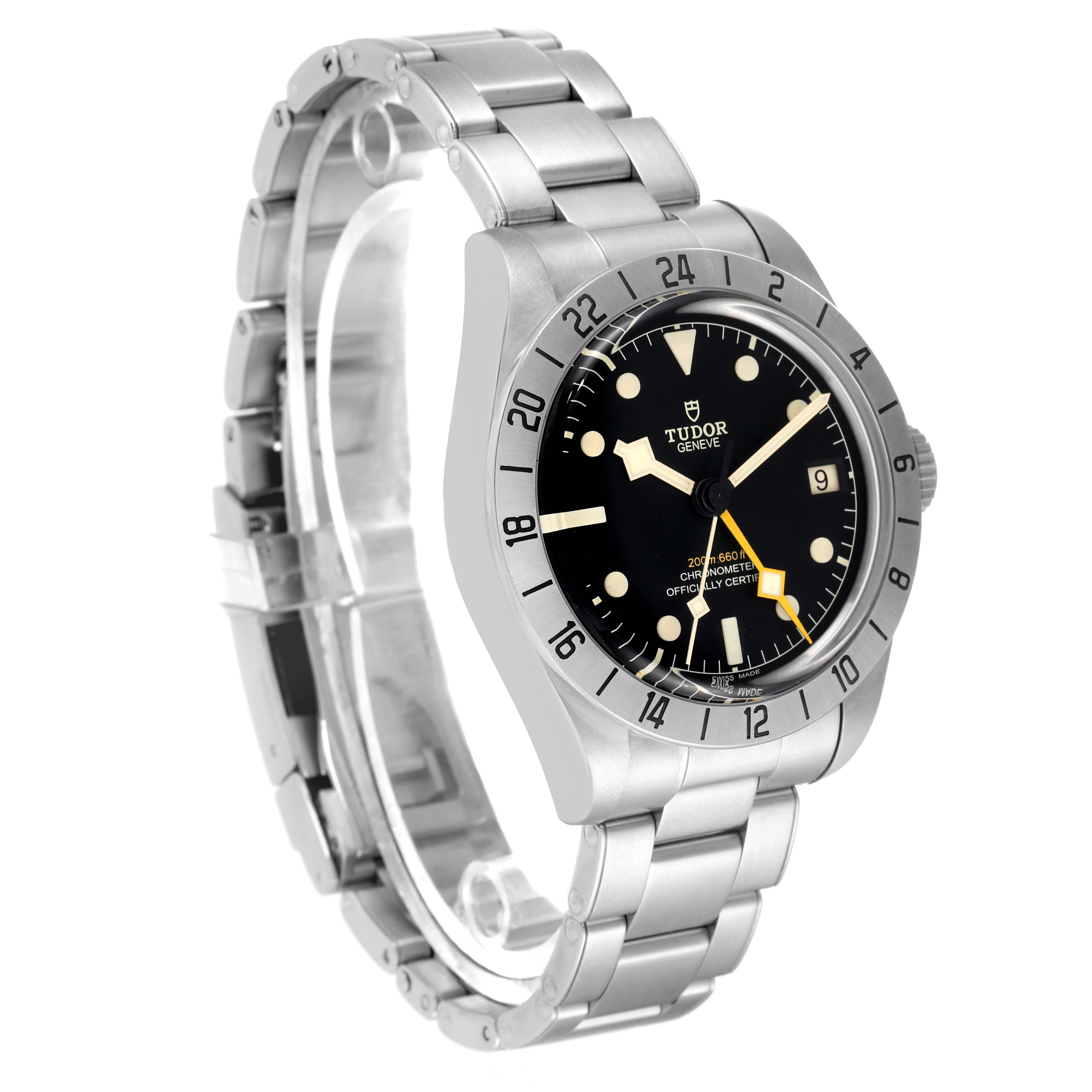 The image shows a side angle of the Tudor Heritage Black Bay M79470 Men's Stainless Steel Black Dial M79470 Men's Stainless Steel Black Dial watch, displaying its face, bezel, and partially open stainless steel bracelet.