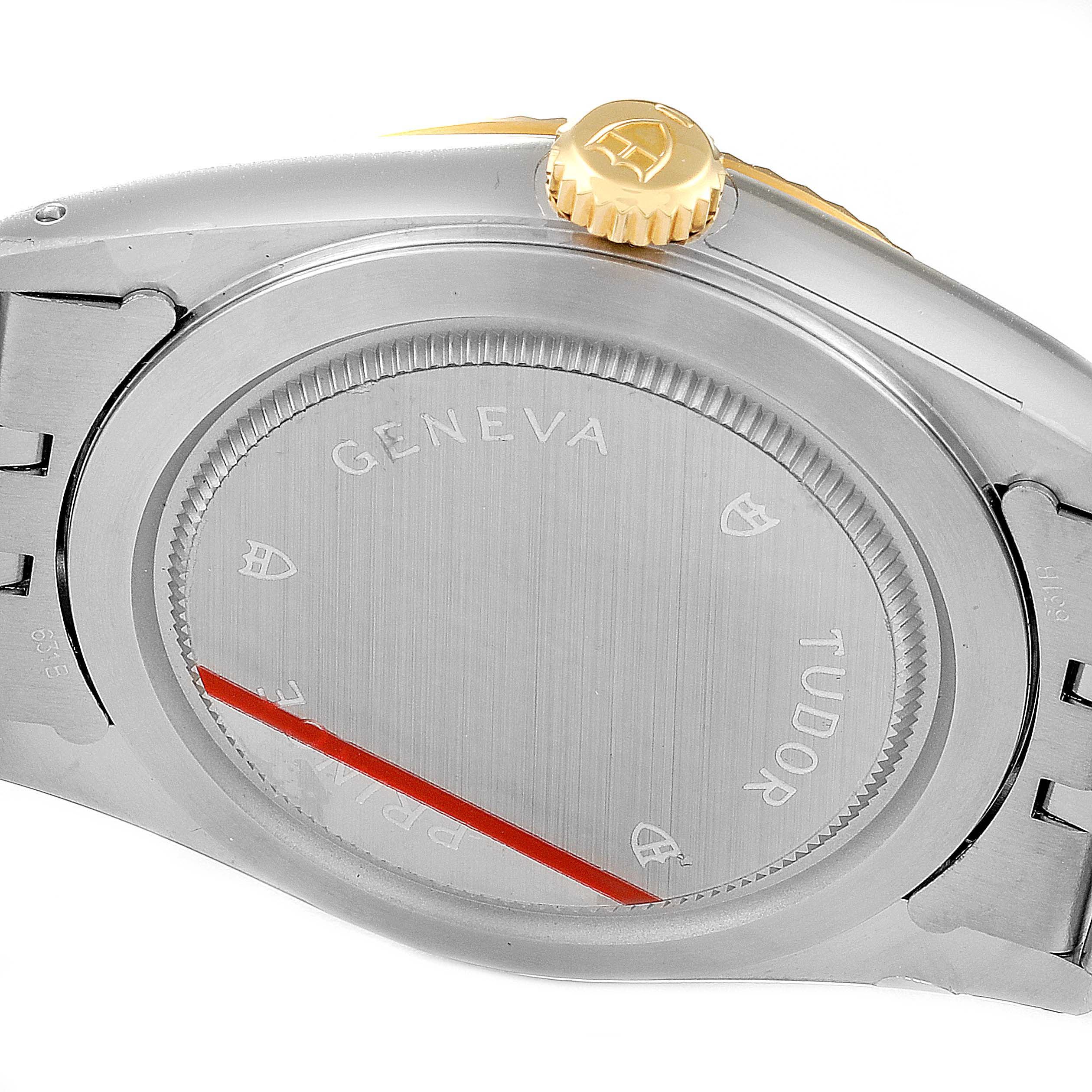 The image shows the back case and winding crown of a Tudor Prince 76213 Men's Steel and Gold (two tone) Champagne Dial 76213 Men's Steel and Gold (two tone) Champagne Dial model watch.