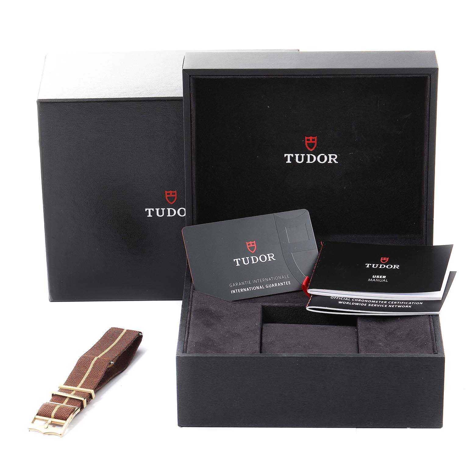 The image shows a Tudor Heritage Black Bay 79012 Men's Bronze Brown Dial 79012 Men's Bronze Brown Dial watch box, international guarantee card, user manual, and an additional strap.
