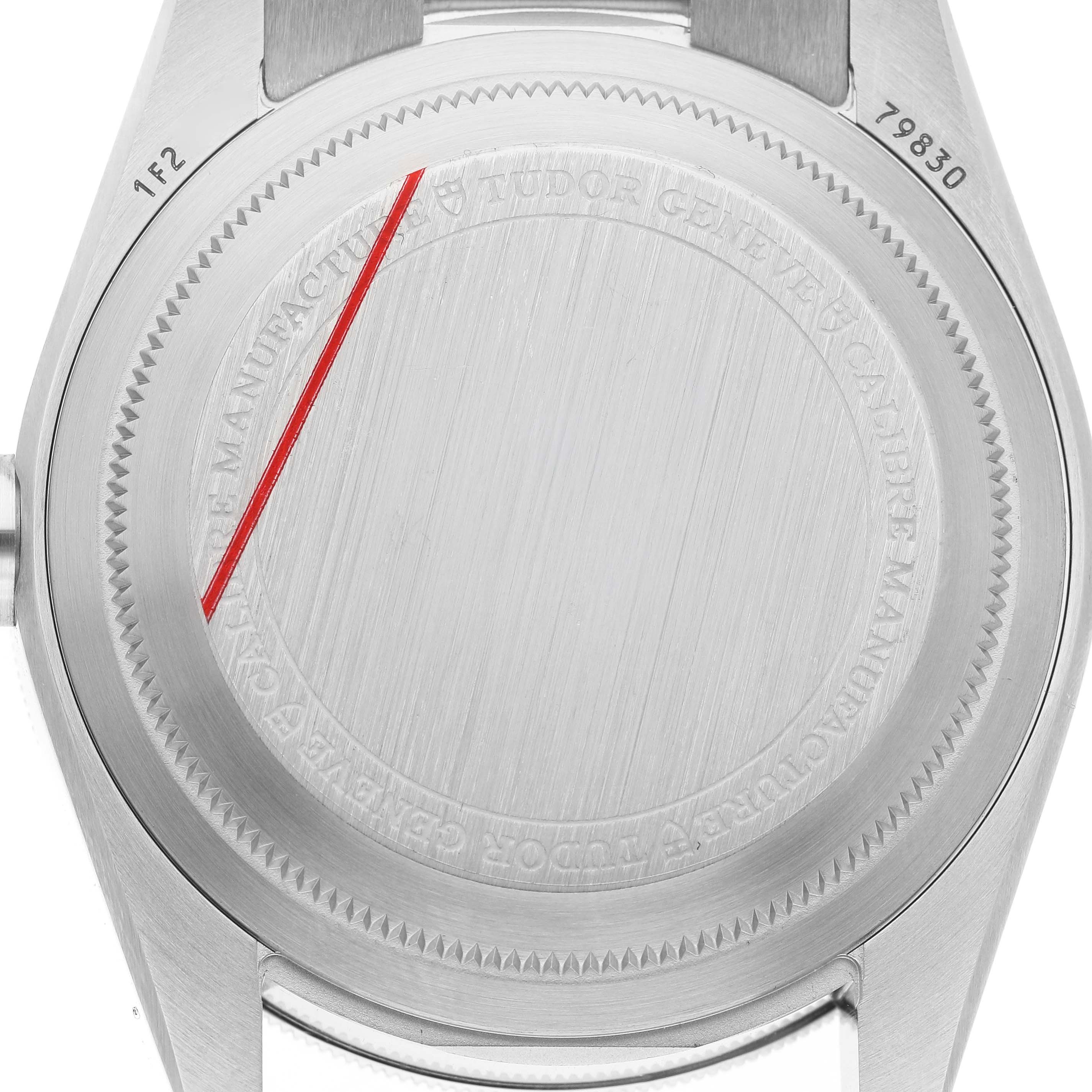 The image shows the back case of the Tudor Heritage Black Bay 79830RB Men's Stainless Steel Silver Dial watch, highlighting its brushed steel texture and engraved details.