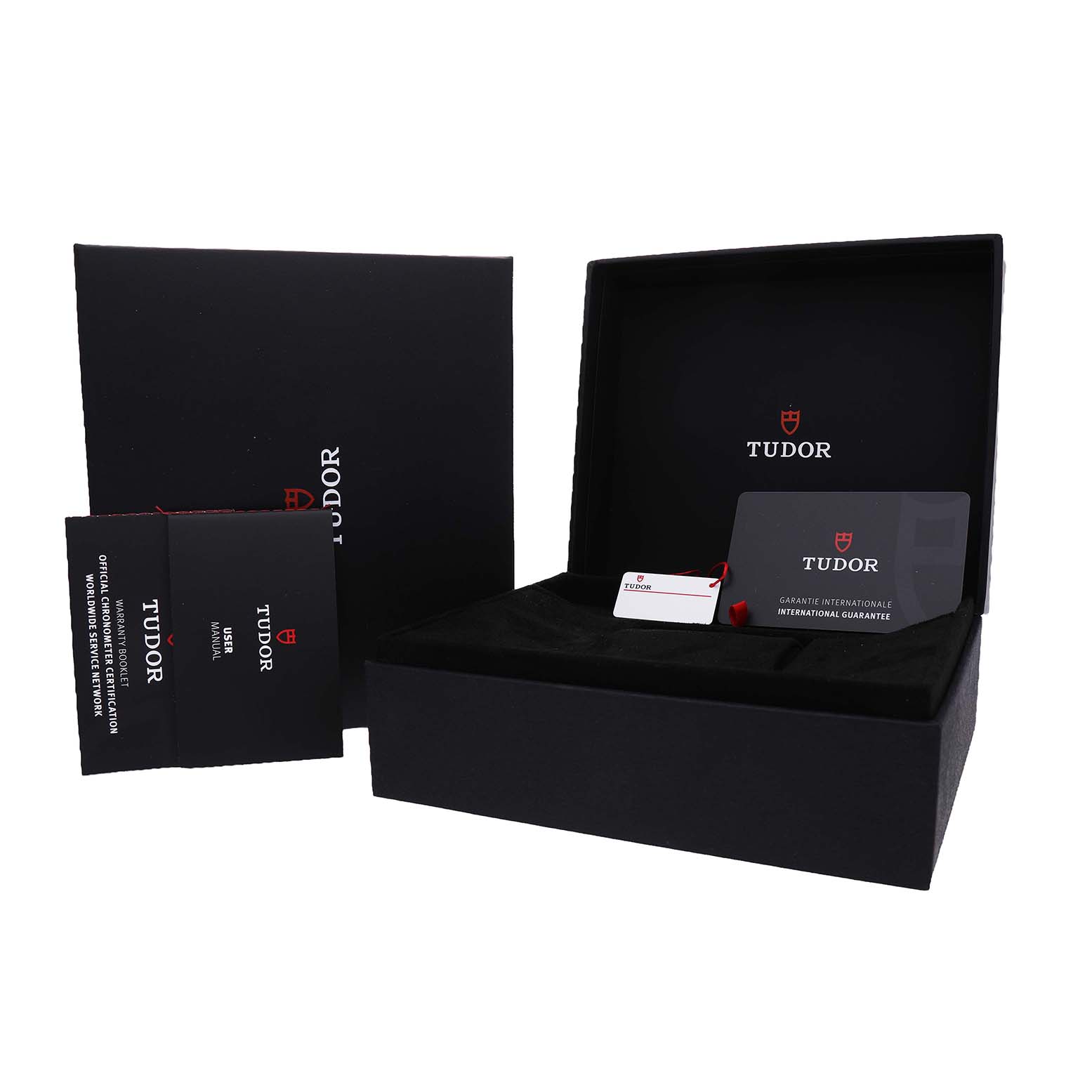The image shows the Tudor Heritage Black Bay 79830RB Men's Stainless Steel Silver Dial packaging at an angle, including the box, manual, and guarantee card.