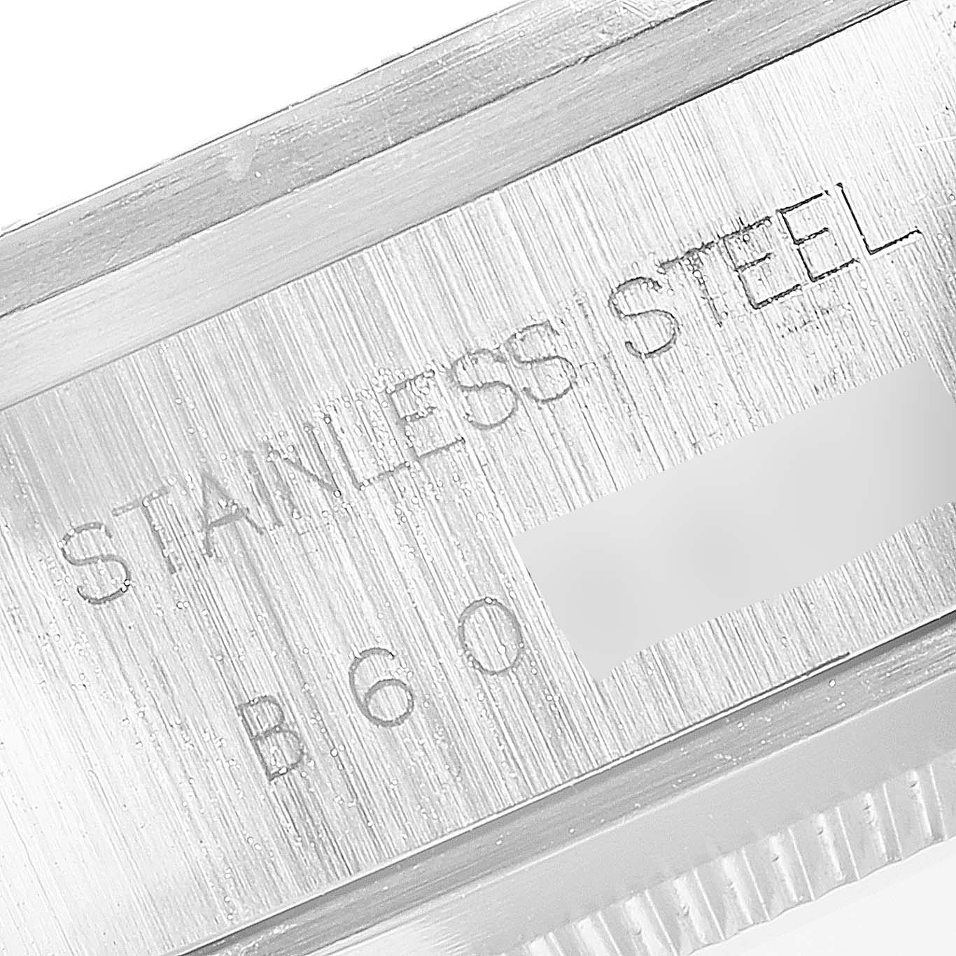 The image shows a close-up of the case of a Tudor Big Block 79170 Men
s Stainless Steel Black Dial 79170 Men
s Stainless Steel Black Dial watch, detailing the "STAINLESS STEEL" engraving.