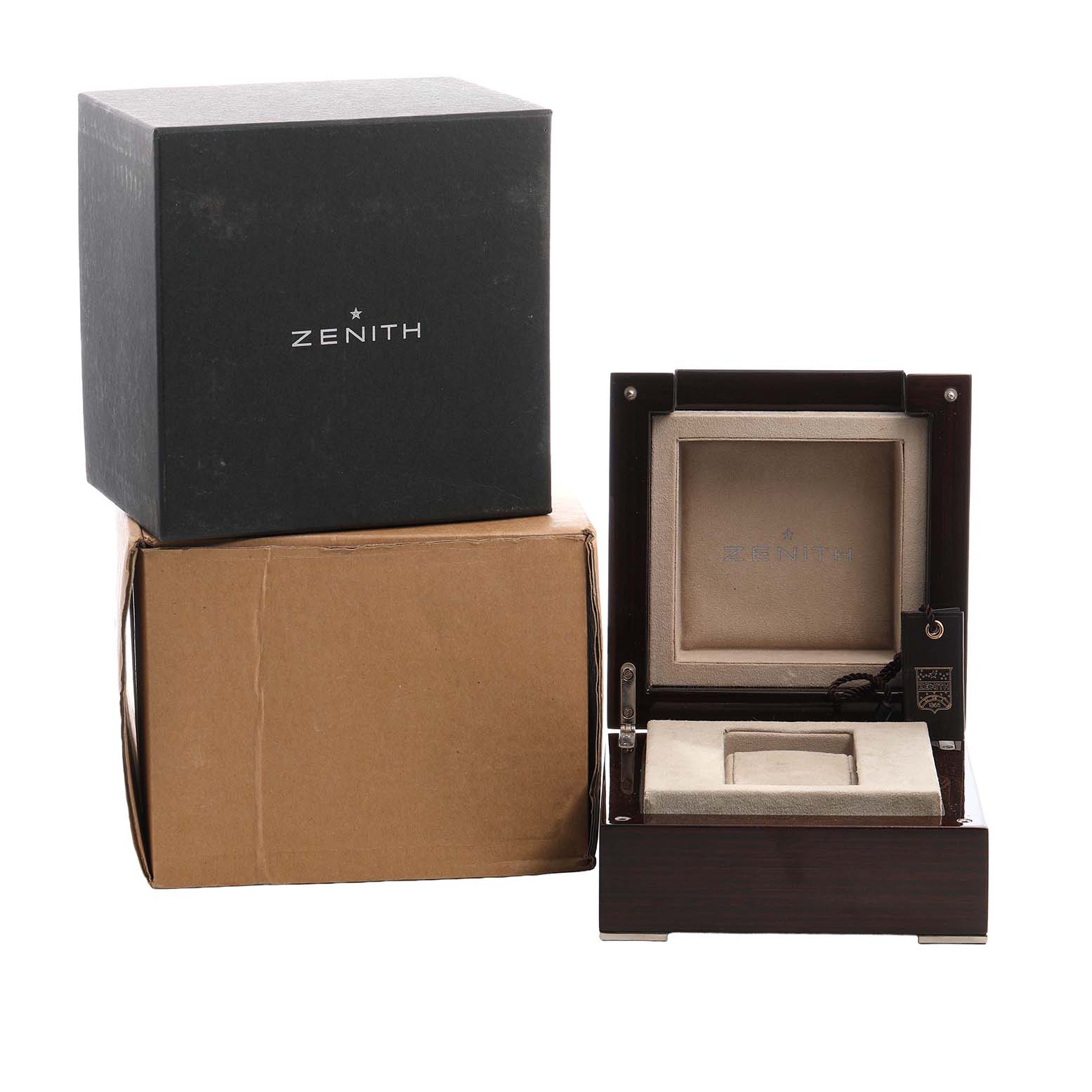 The image shows a Zenith Defy 96.0528.4000/21.R642 Men's Titanium Transparent Dial watch box and packaging, including an opened display box and outer cartons.
