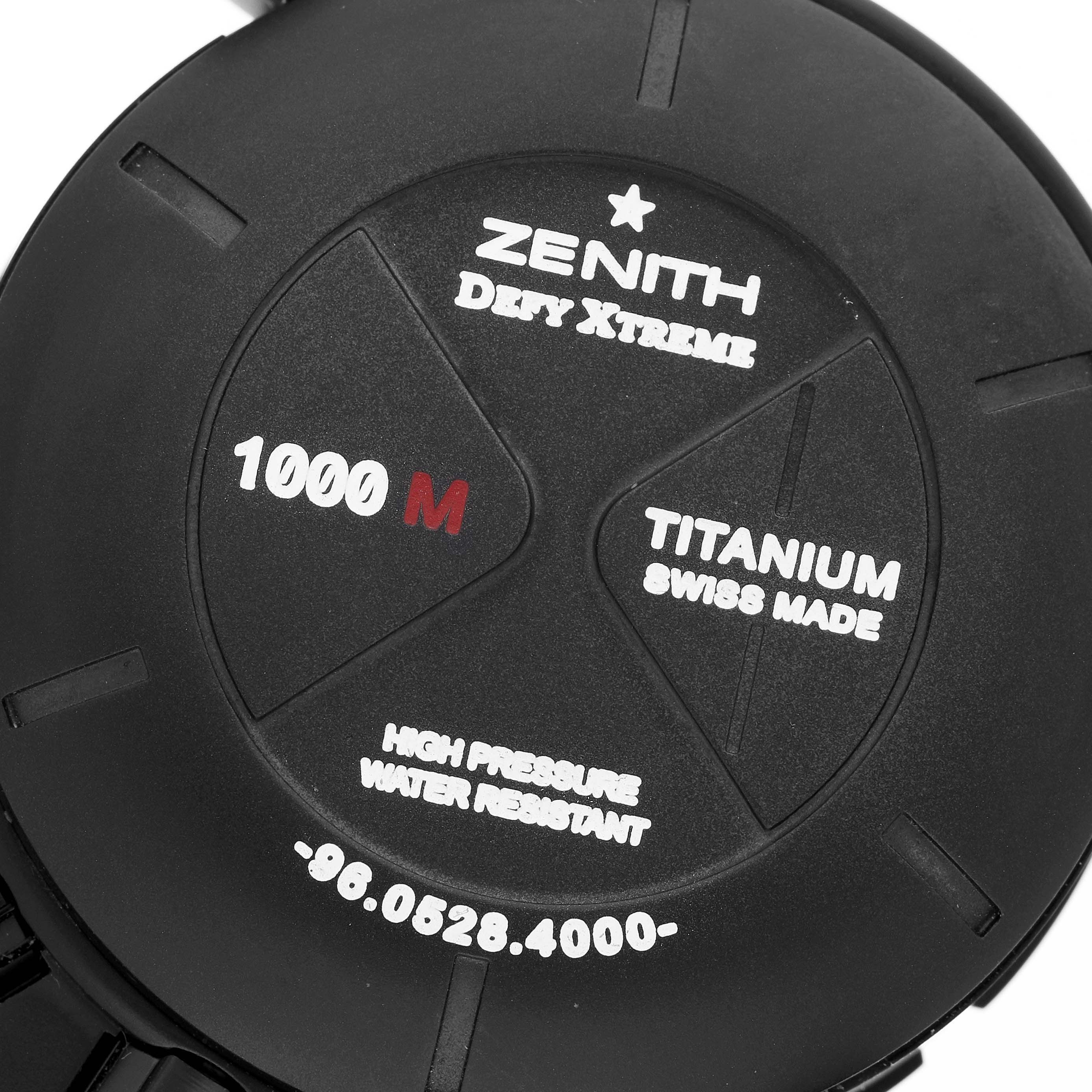 The image shows the back case of a Zenith Defy 96.0528.4000/21.R642 Men's Titanium Transparent Dial Xtreme watch, highlighting its titanium construction and water resistance.