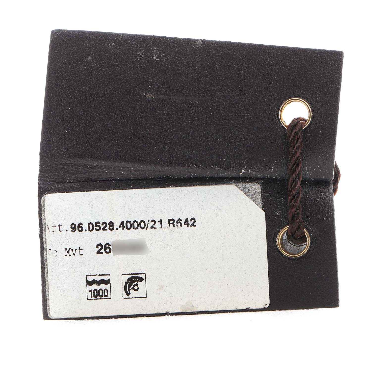 The image shows a close-up of the leather tag for a Zenith Defy 96.0528.4000/21.R642 Men's Titanium Transparent Dial watch, including the model number and some symbols.