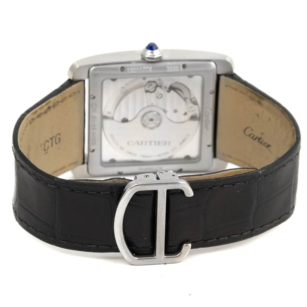 The image shows the back view of the Cartier W5330003 Men
s Stainless Steel Silver Dial W5330003 Men
s Stainless Steel Silver Dial Tank MC Silver Dial Automatic Mens Watch W5330003, highlighting the movement and black leather strap.