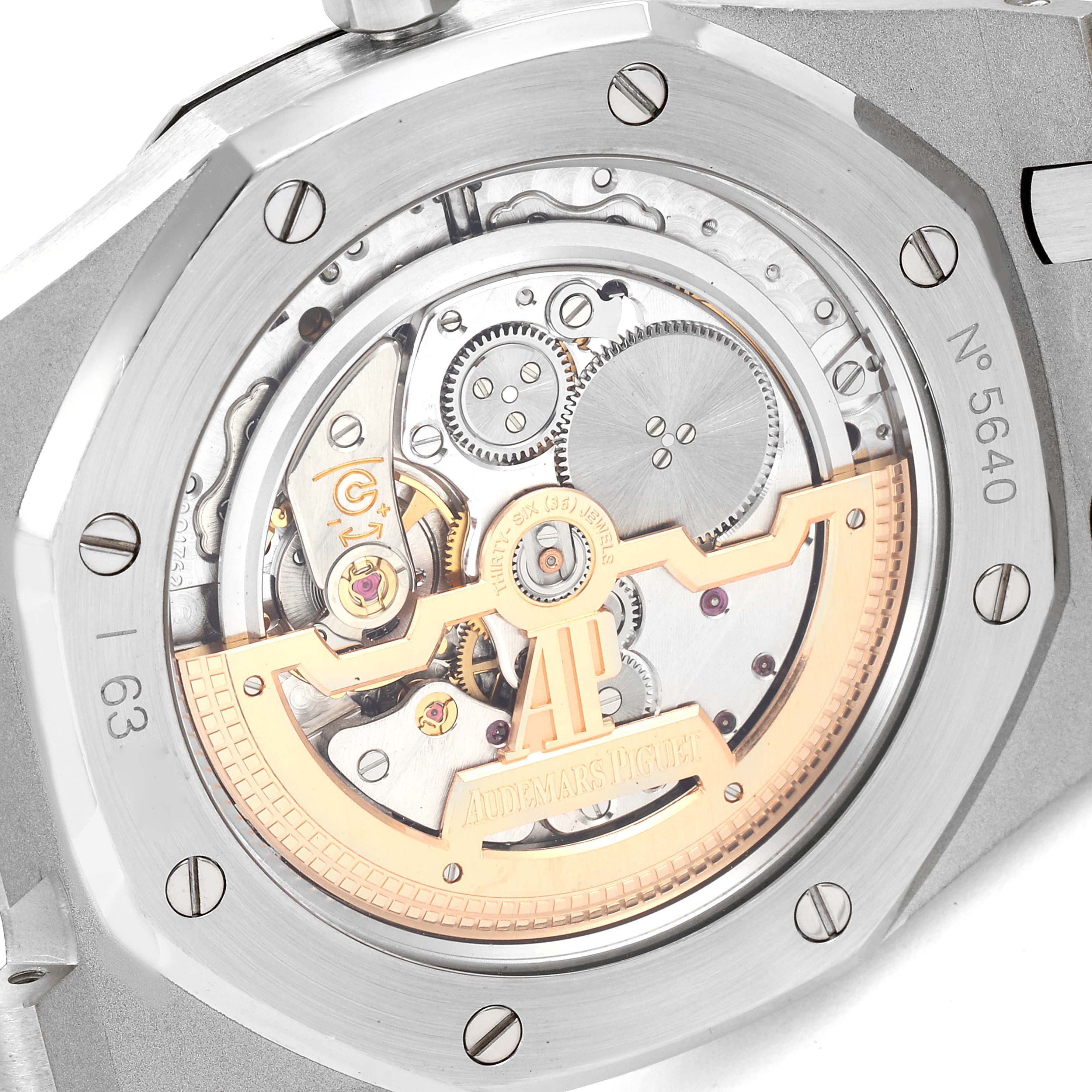 This image shows the back view of an Audemars Piguet Royal Oak 15202ST.OO.1240ST.01 Men's Stainless Steel Blue Dial 15202ST.OO.1240ST.01 Men's Stainless Steel Blue Dial watch, displaying its intricate movement and rotor.