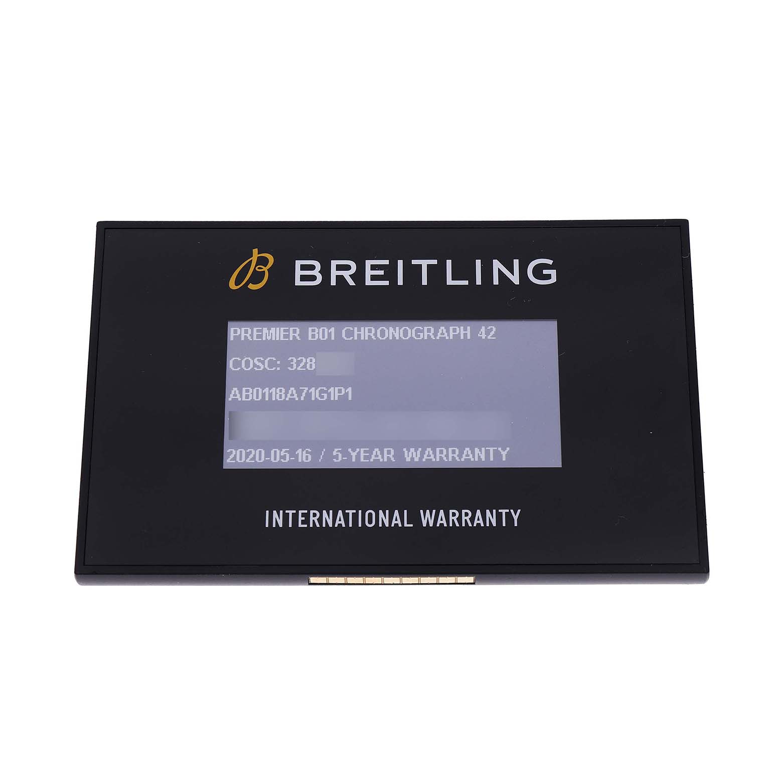 The image shows a Breitling Premier AB0118 Men's Stainless Steel Silver Dial model international warranty card from a top view.