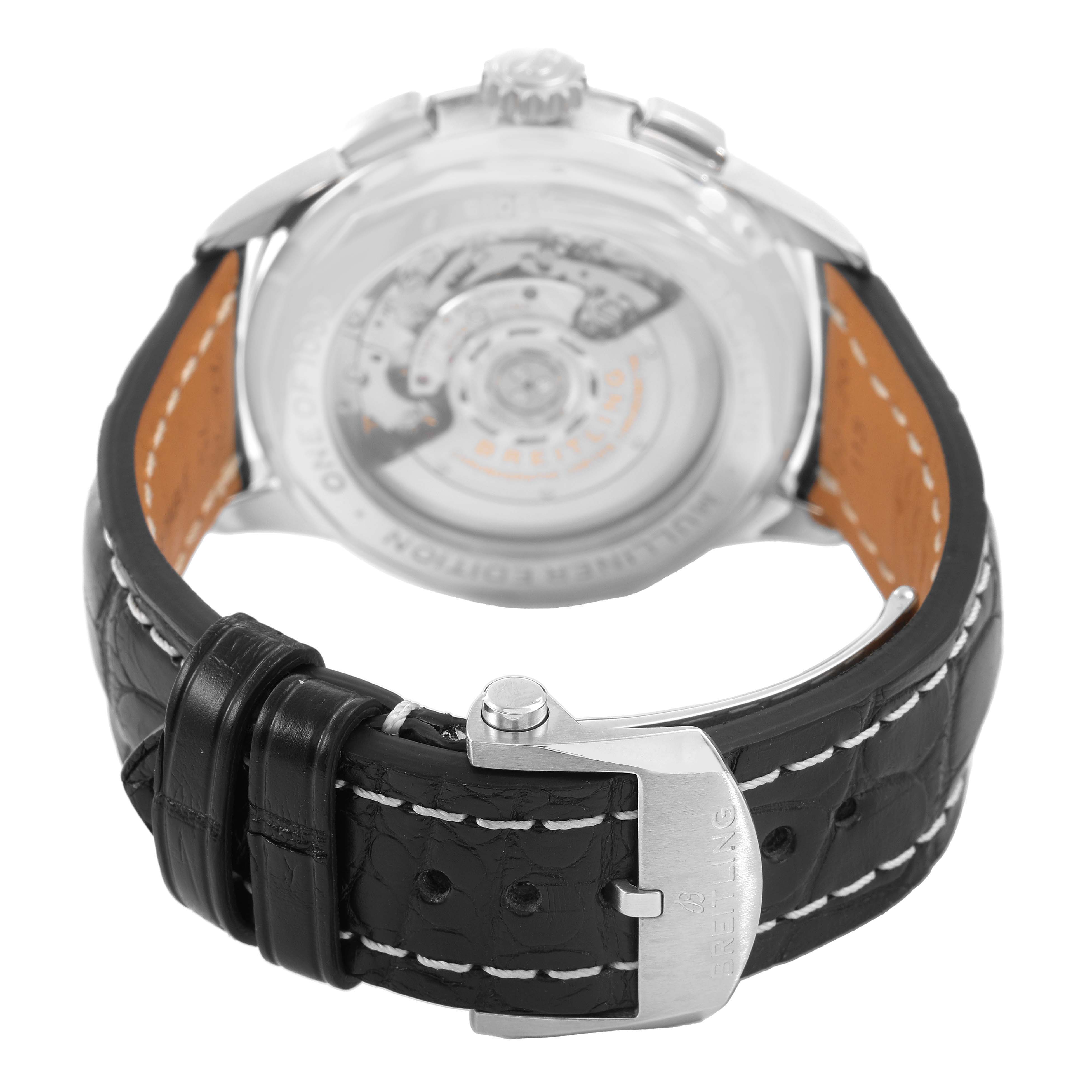 The Breitling Premier AB0118 Men's Stainless Steel Silver Dial watch is shown from the rear, highlighting the buckle, strap, and transparent case back.