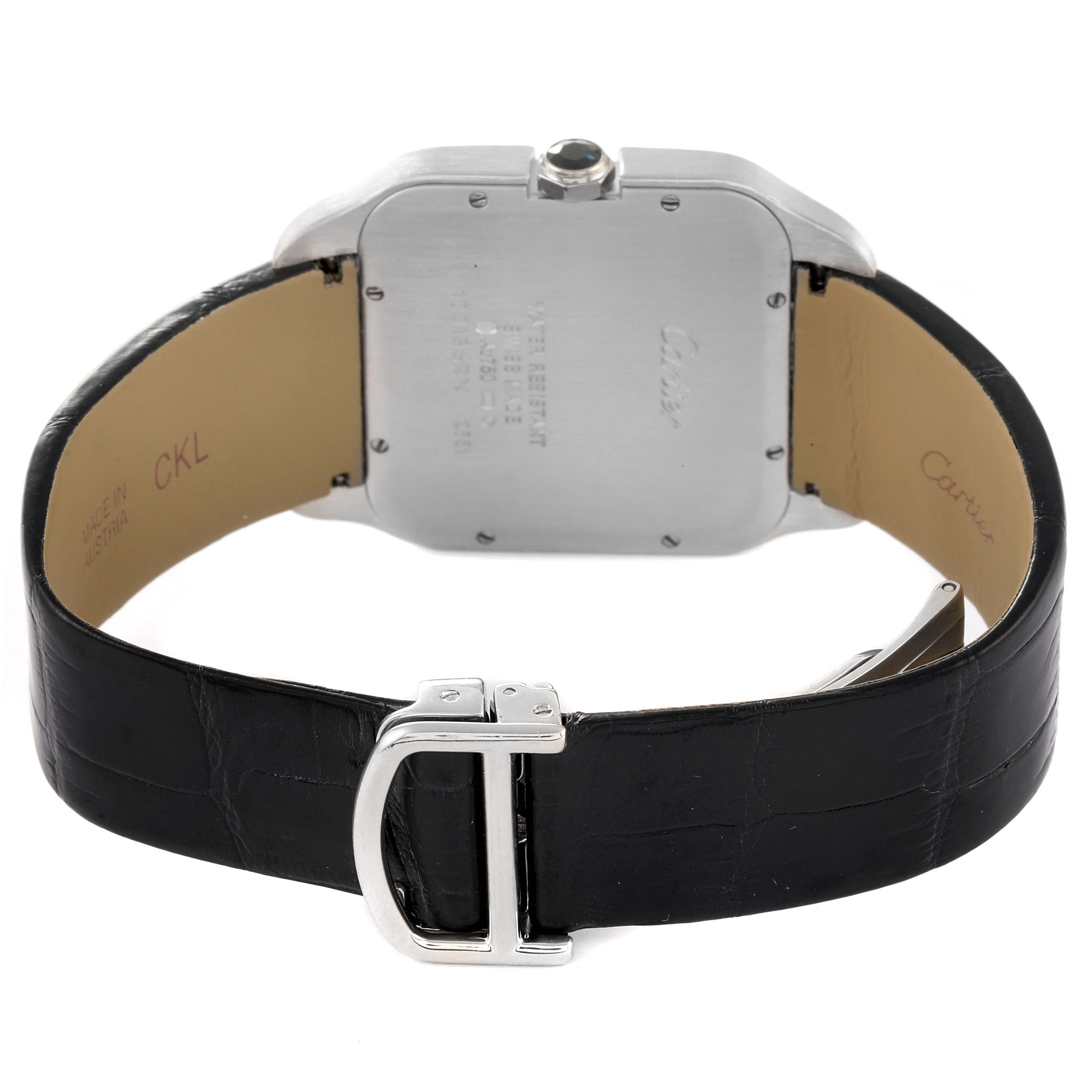 The image shows the back view of the Santos Dumont watch by Cartier, with the case back, leather strap, and buckle visible.