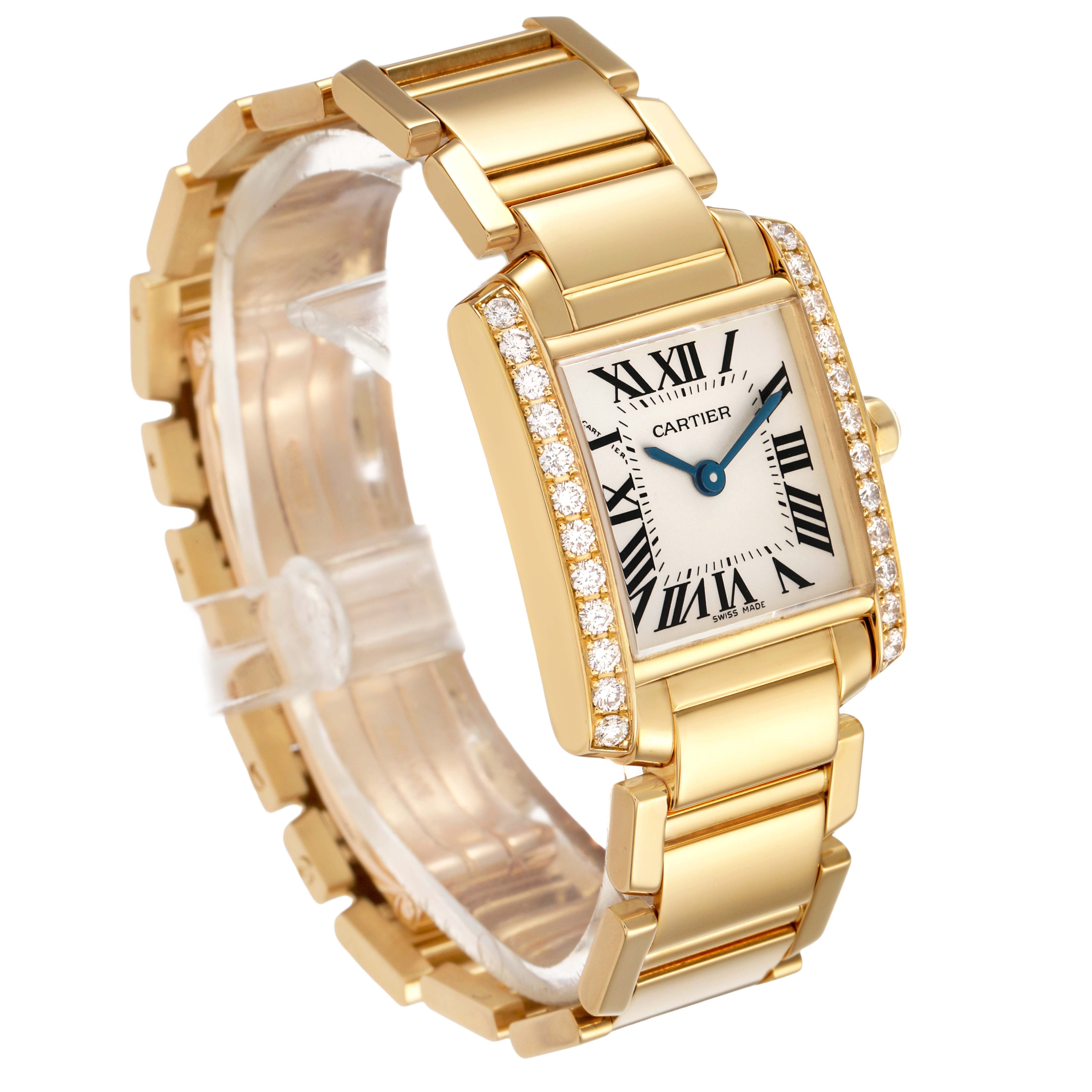 The Cartier Tank Francaise WE1001R8 Women's Yellow Gold Silver Dial watch is shown at an angled view, highlighting its gold bracelet, diamond-set bezel, and Roman numeral dial.