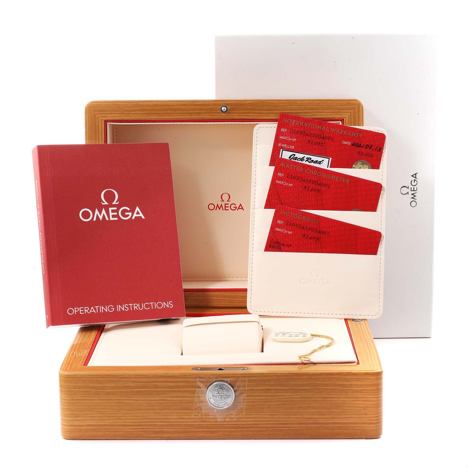 This image shows the packaging contents for an Omega Seamaster 210.32.42.20.04.001 Men's Stainless Steel White Dial 210.32.42.20.04.001 Men's Stainless Steel White Dial model, including the box, operating instructions, and warranty cards.
