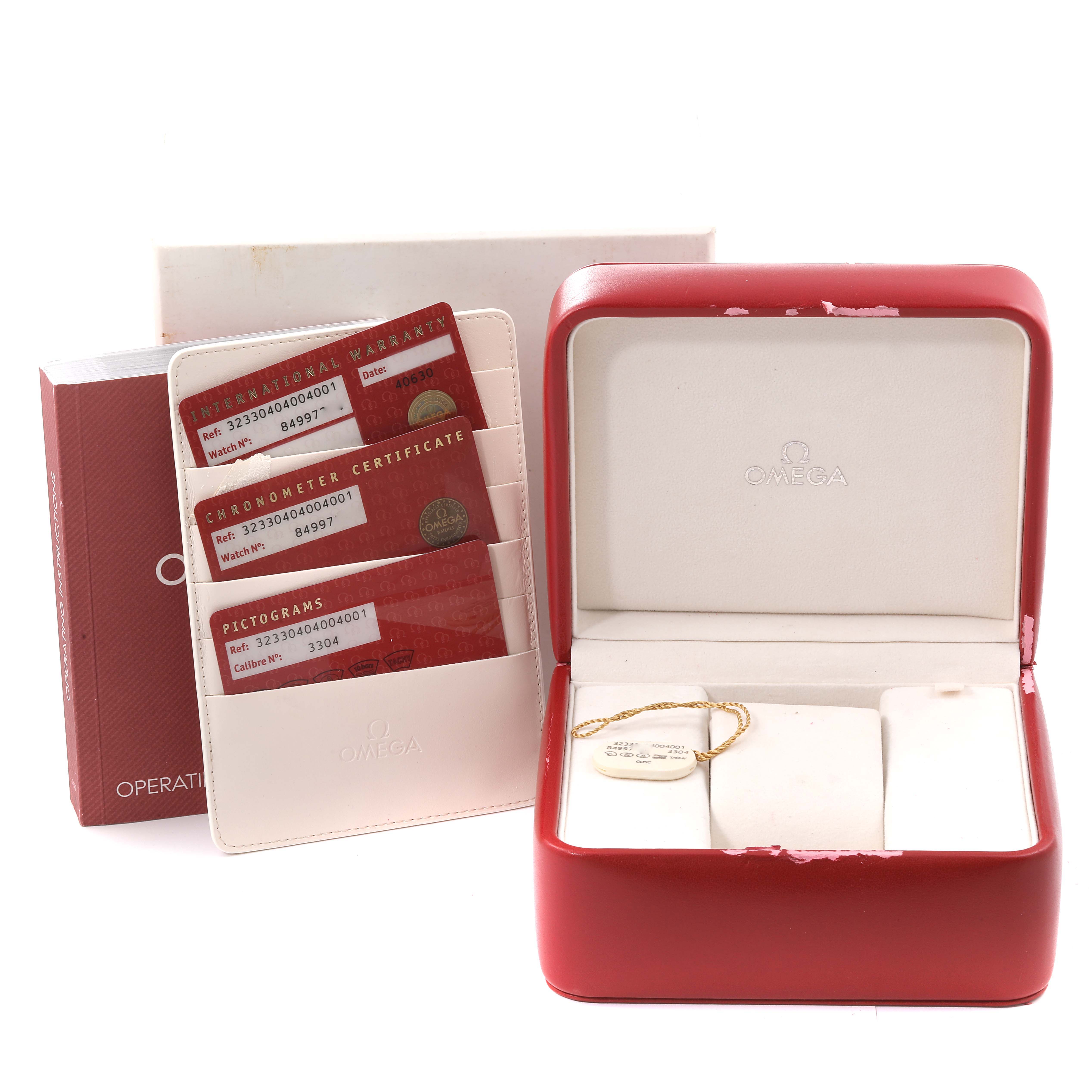 This image shows the packaging and documentation for an Omega Speedmaster 323.30.40.40.04.001 Men's Stainless Steel White Dial 323.30.40.40.04.001 Men's Stainless Steel White Dial watch, including the box, cards, and manual.