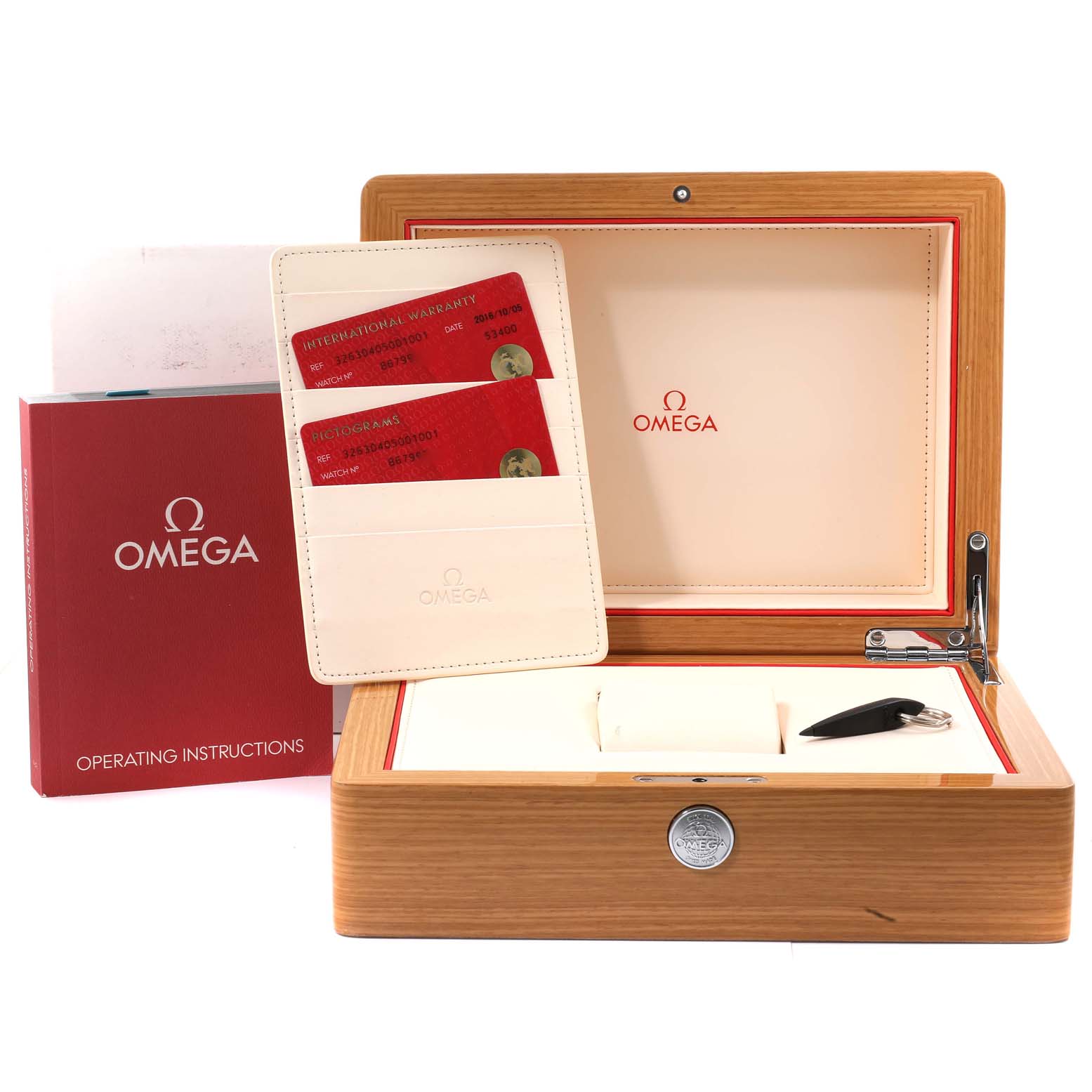 The image shows an Omega Speedmaster 326.30.40.50.01.001 Men's Stainless Steel Black Dial 326.30.40.50.01.001 Men's Stainless Steel Black Dial watch box with warranty cards, instructions manual, and key.