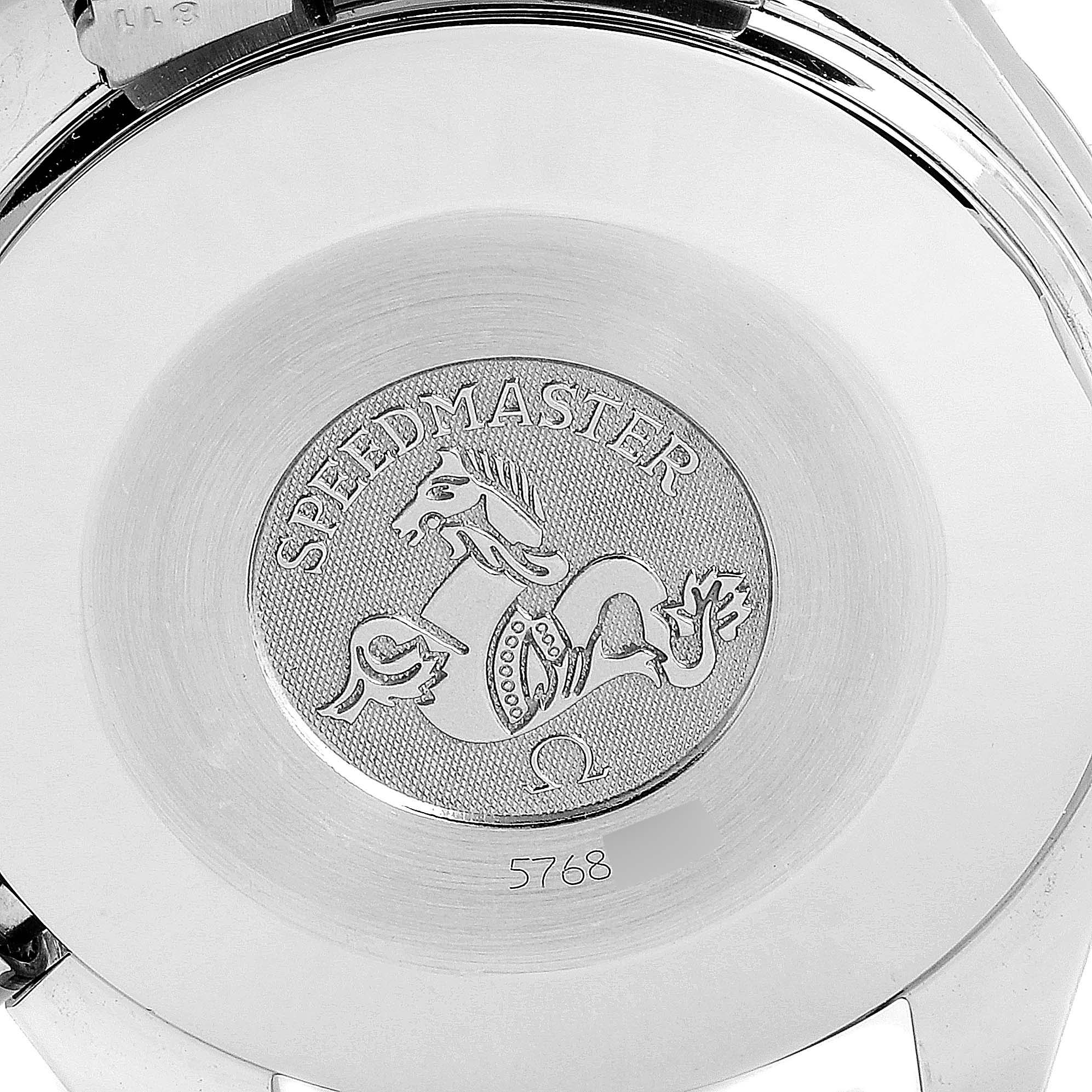 The image shows the back case of an Omega Speedmaster 3510.20.00 Men
s Stainless Steel White Dial 3510.20.00 Men
s Stainless Steel White Dial watch with its emblem and model number.