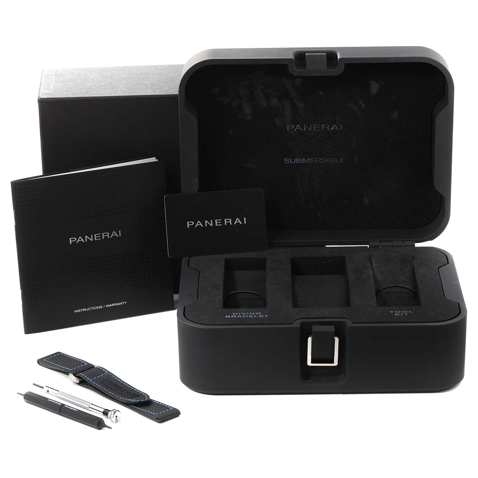 The image shows the packaging, instruction manual, watch strap, and tools for a Panerai Submersible PAM00973 Men's Stainless Steel Black Dial PAM00973 Men's Stainless Steel Black Dial watch.