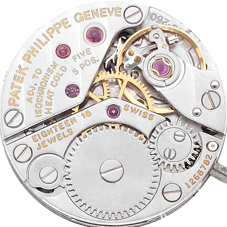 This image shows the intricate inner workings and gears of the Patek Philippe Calatrava 4182 Women's White Gold Blue Dial 4182 Women's White Gold Blue Dial watch, highlighting its Swiss movement and jewel count.