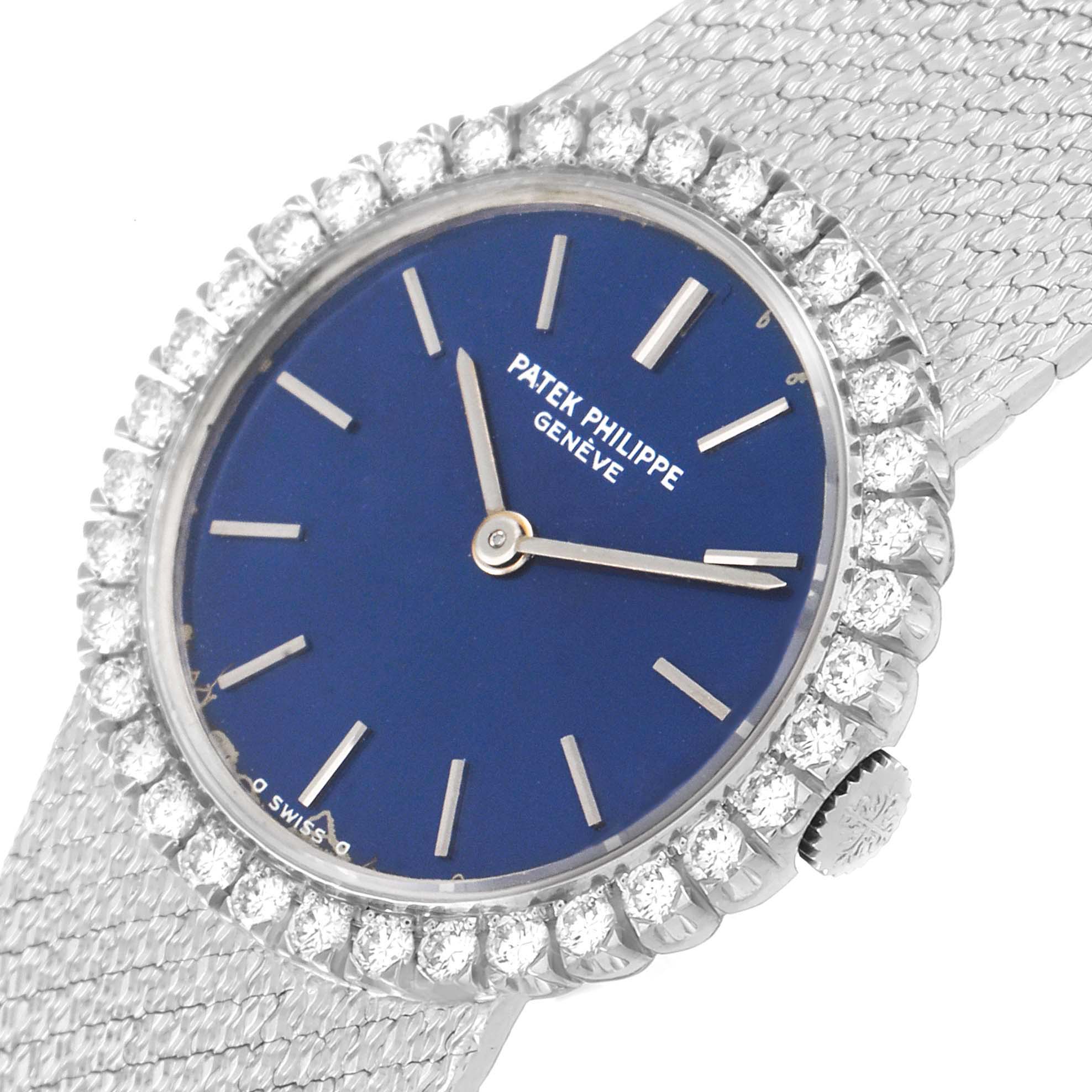 The image shows a Patek Philippe Calatrava 4182 Women's White Gold Blue Dial 4182 Women's White Gold Blue Dial watch face at a slight angle, highlighting its blue dial, diamond-set bezel, and silver strap.