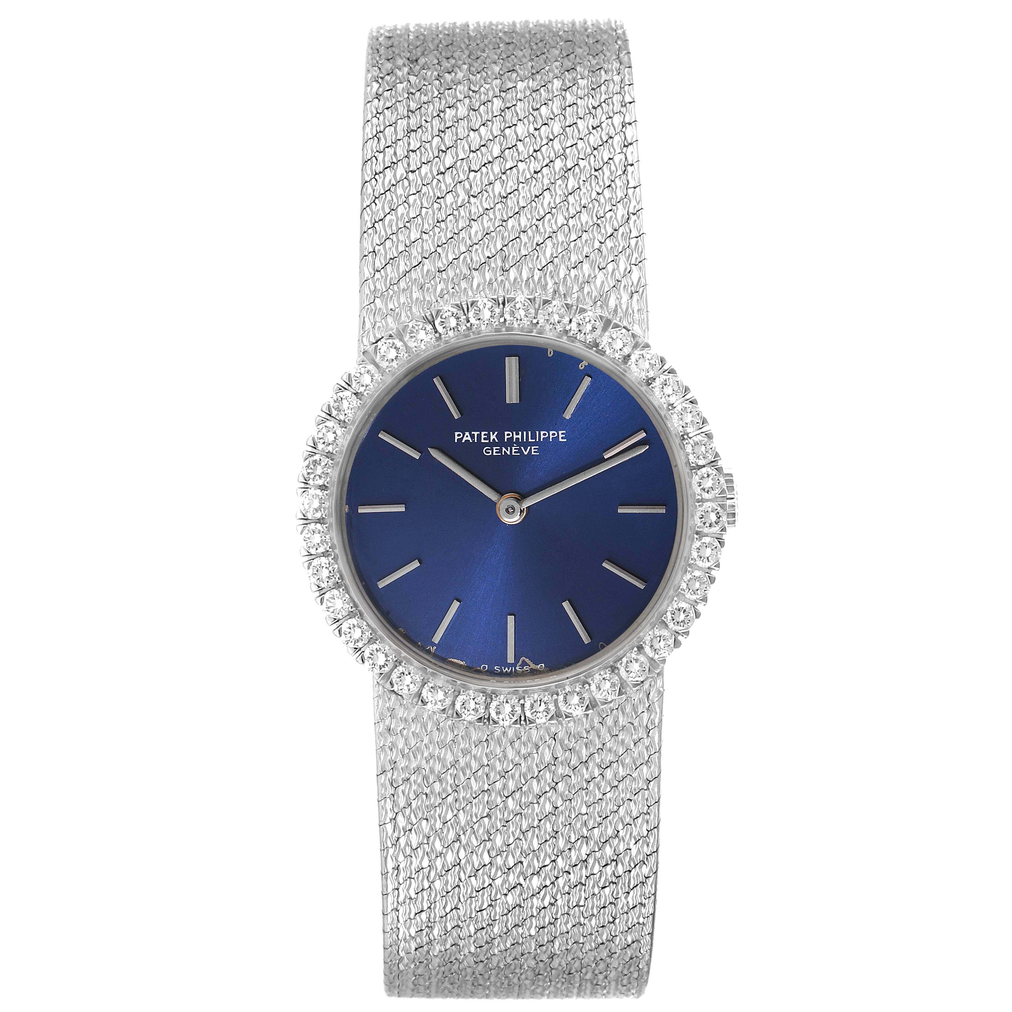 The image shows a frontal view of a Patek Philippe Calatrava 4182 Women's White Gold Blue Dial 4182 Women's White Gold Blue Dial watch with a blue dial, diamond bezel, and silver mesh strap.