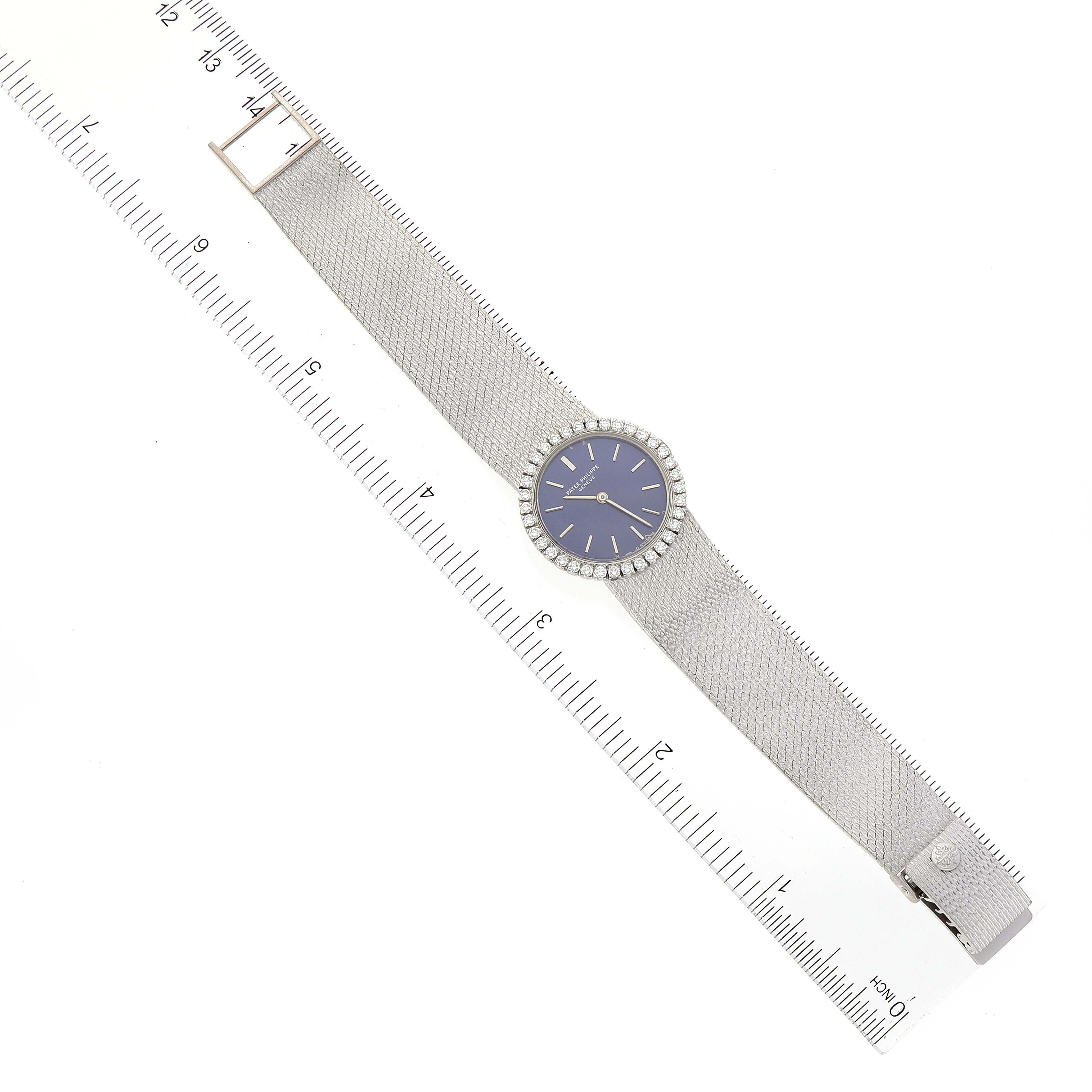 The image shows a top-down view of a Patek Philippe Calatrava 4182 Women's White Gold Blue Dial 4182 Women's White Gold Blue Dial watch, displaying its dial and full strap with a ruler for size reference.