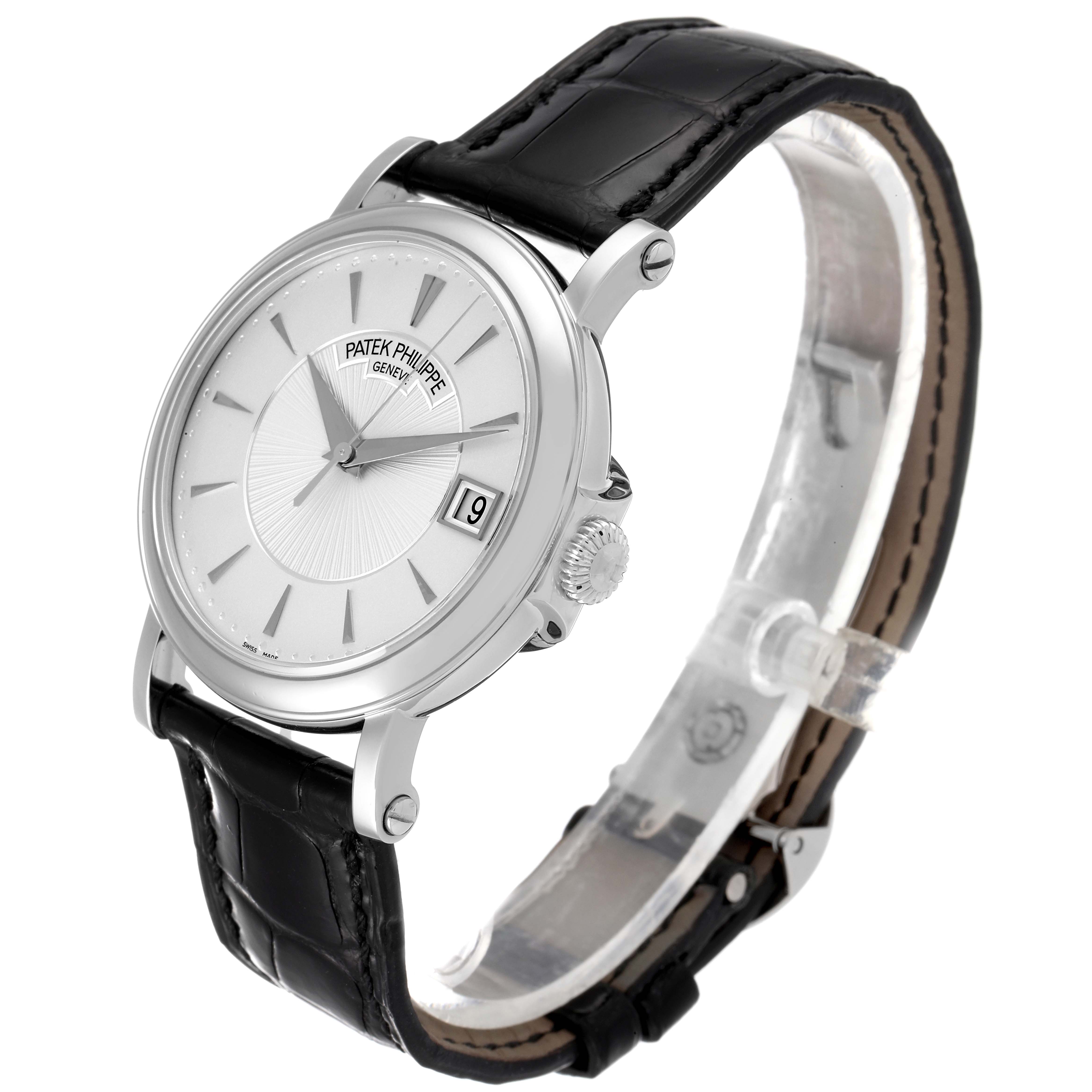This image shows a Patek Philippe Calatrava 5153G Men
s White Gold Silver Dial 5153G Men
s White Gold Silver Dial watch at a slight side angle, featuring its dial, crown, date window, and leather strap.