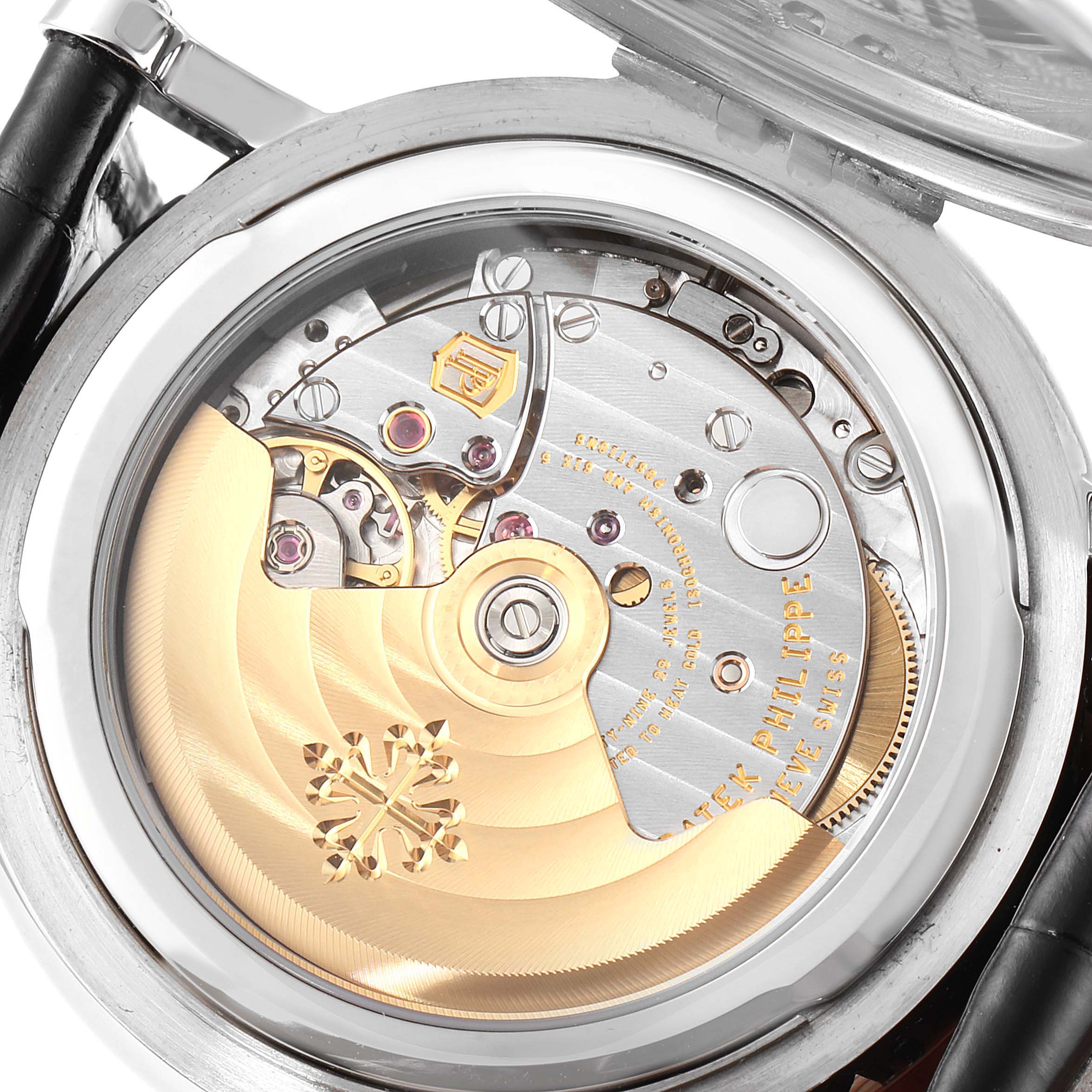 The image shows the back view of the Calatrava model by Patek Philippe, highlighting its intricate movement mechanism.