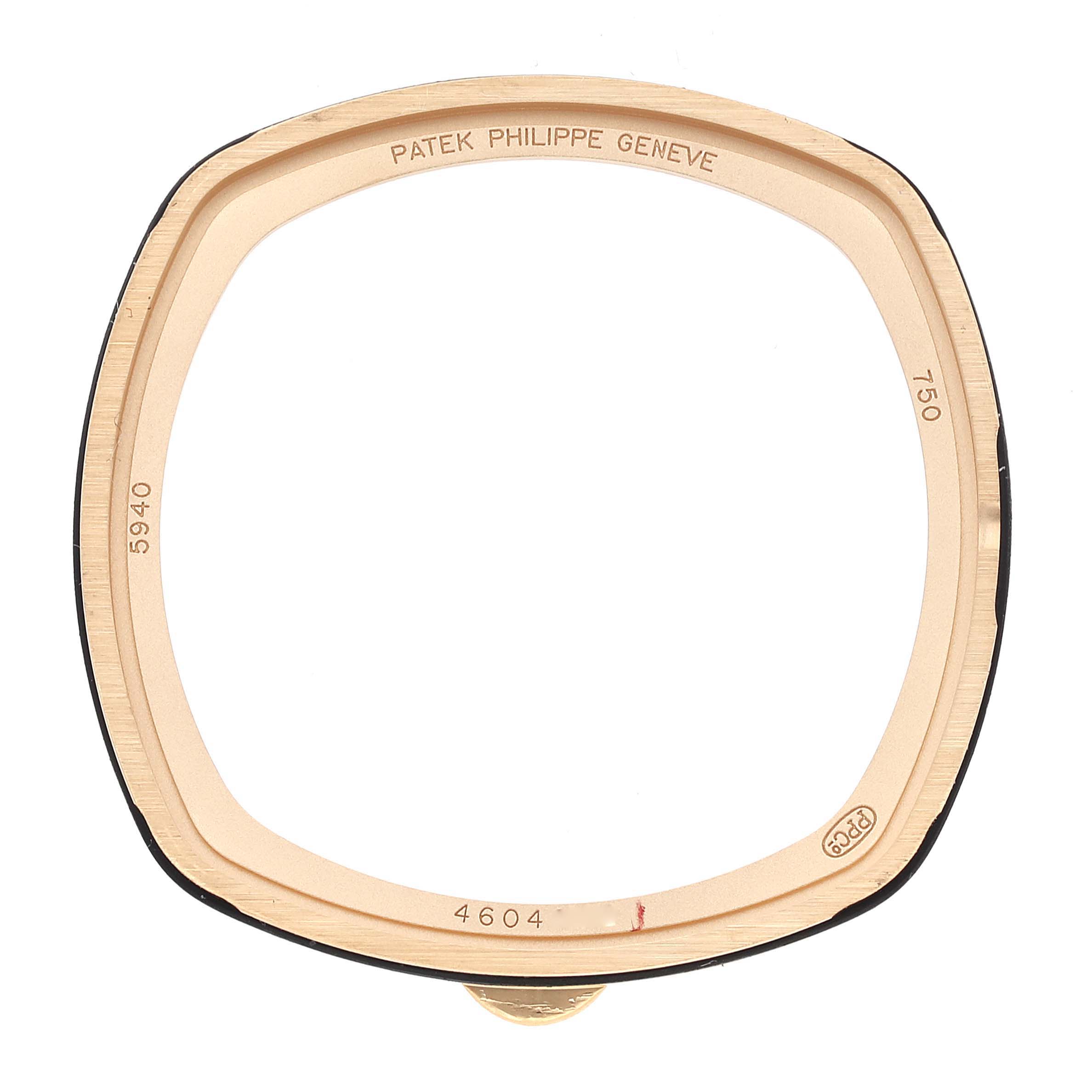 This is the back case of a Patek Philippe Complications 5940J - 001 Men's Yellow Gold Silver Dial 5940J - 001 Men's Yellow Gold Silver Dial model, shown from a top-down angle.