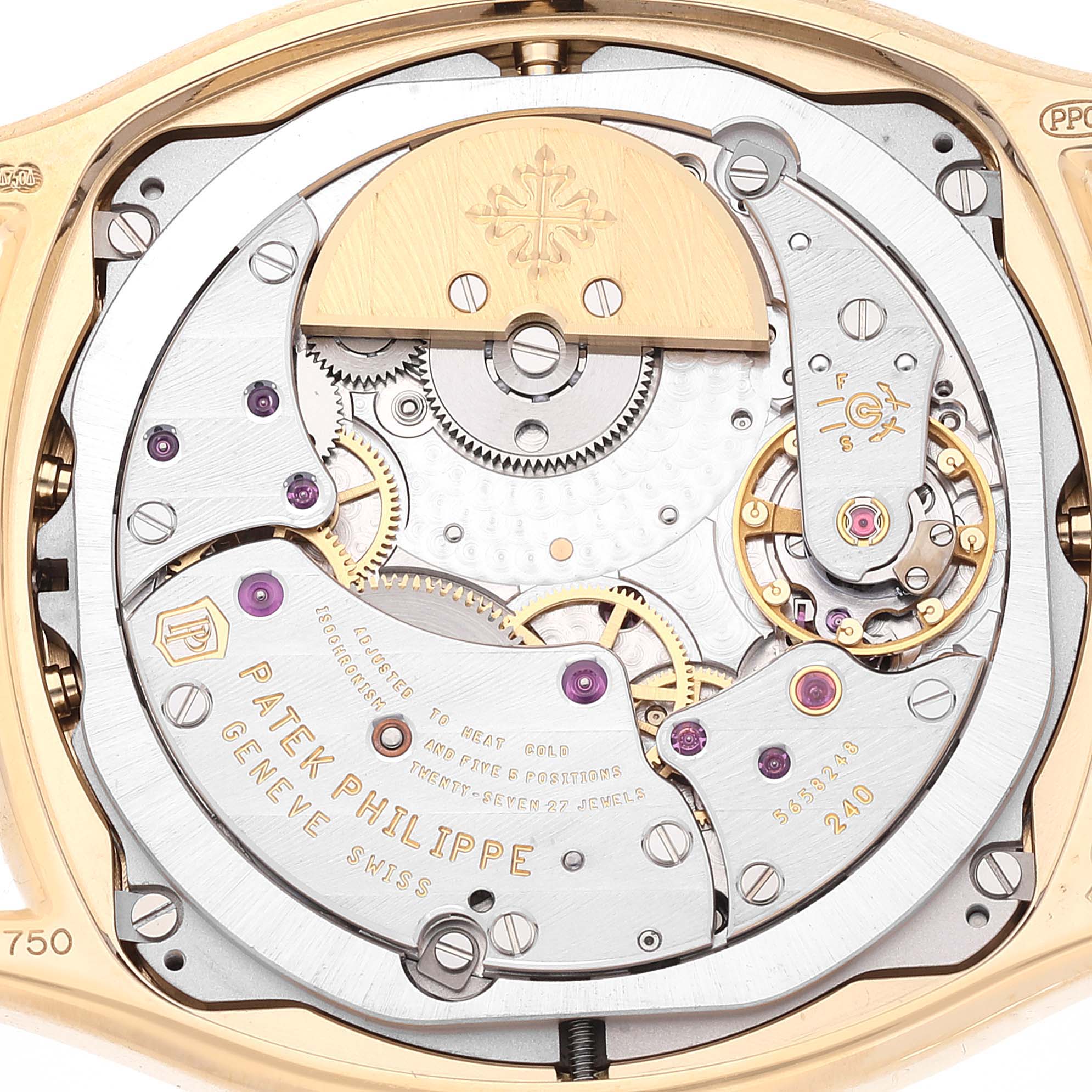 The image shows the intricate back view of a Patek Philippe Complications 5940J - 001 Men's Yellow Gold Silver Dial 5940J - 001 Men's Yellow Gold Silver Dial model, highlighting the internal mechanical movement.