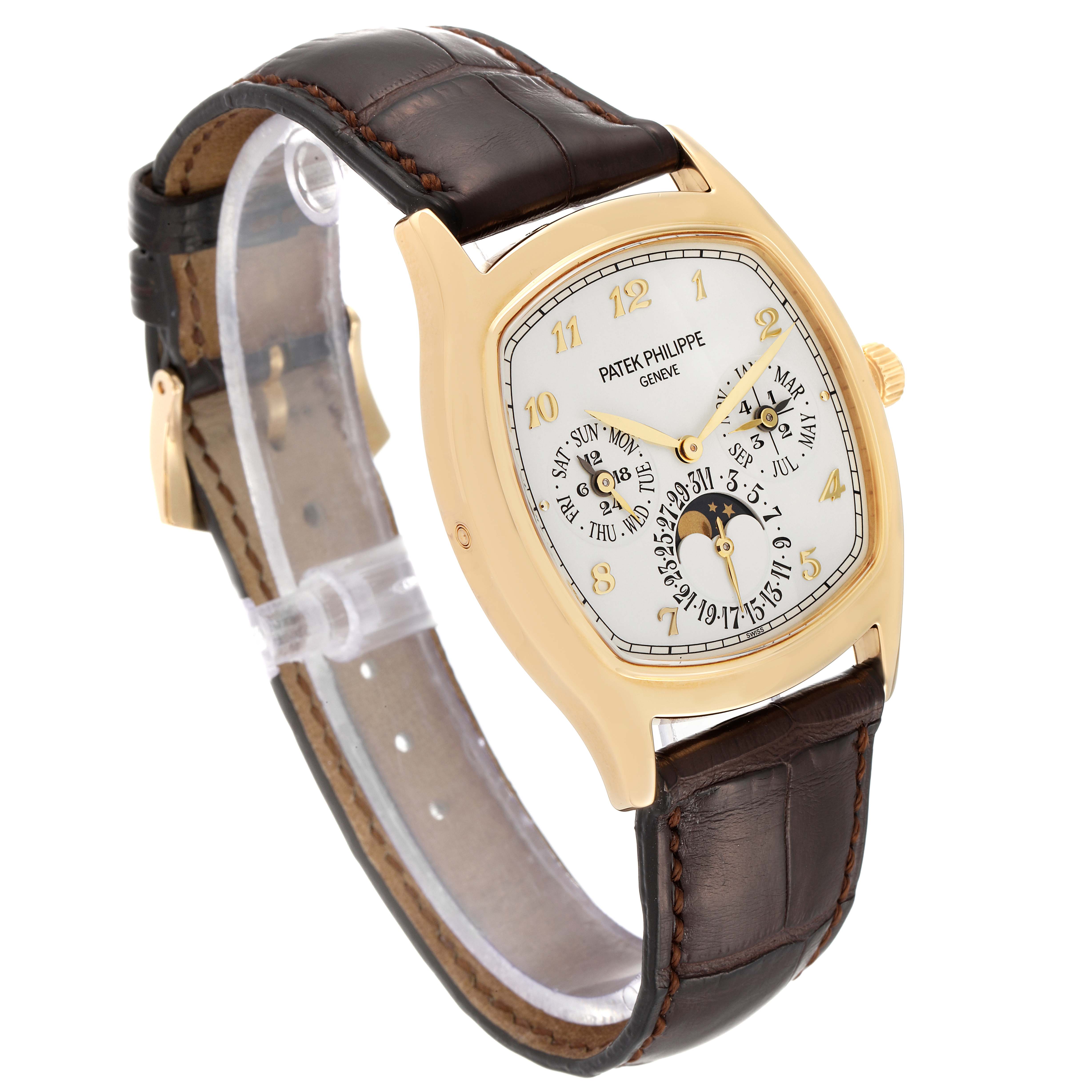 The image shows a Patek Philippe Complications 5940J - 001 Men's Yellow Gold Silver Dial 5940J - 001 Men's Yellow Gold Silver Dial model watch at a three-quarter angle showcasing its dial and leather strap.