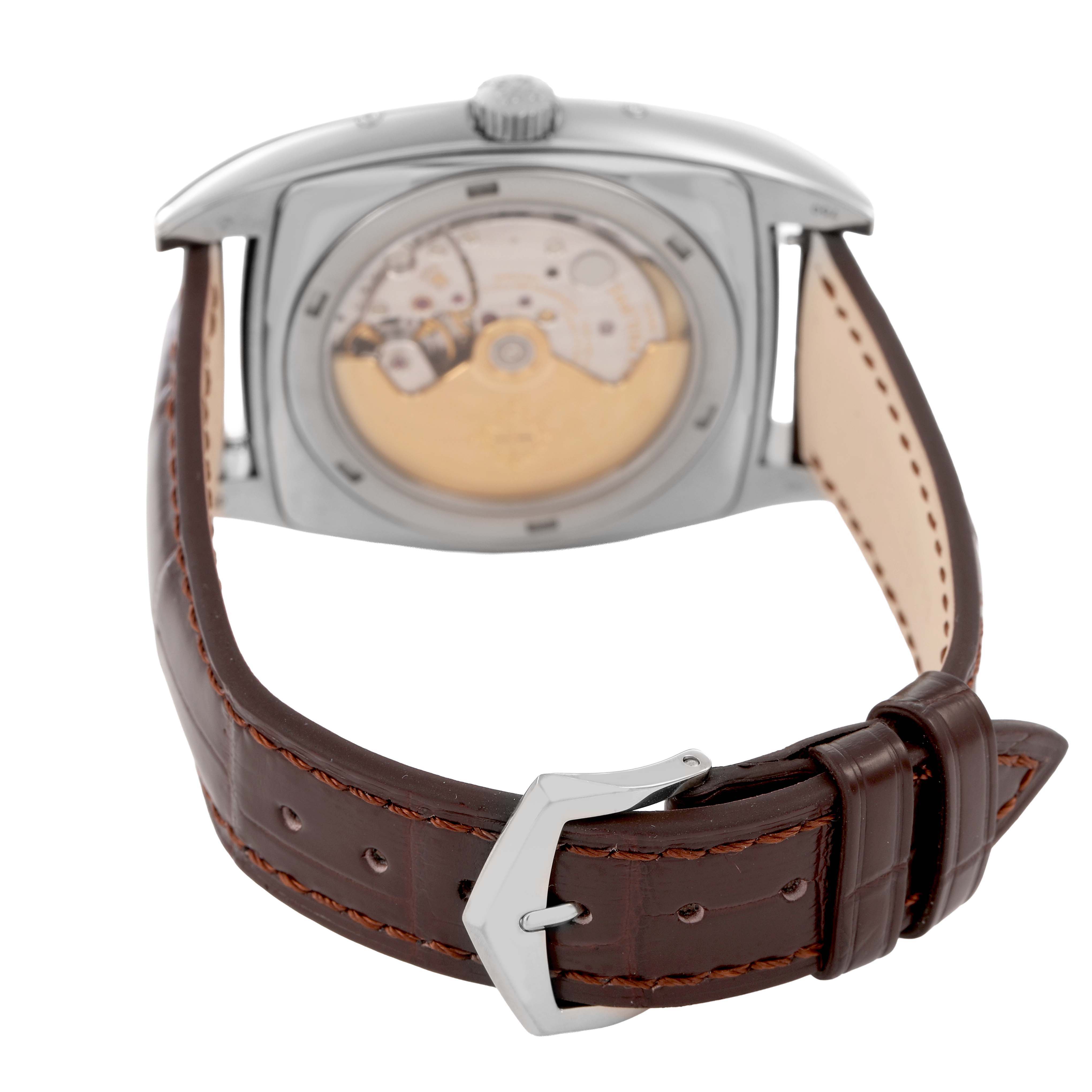 The image shows the back view of a Patek Philippe Gondolo 5135G-001 Men's White Gold Silver Dial watch, highlighting the movement and brown leather strap.