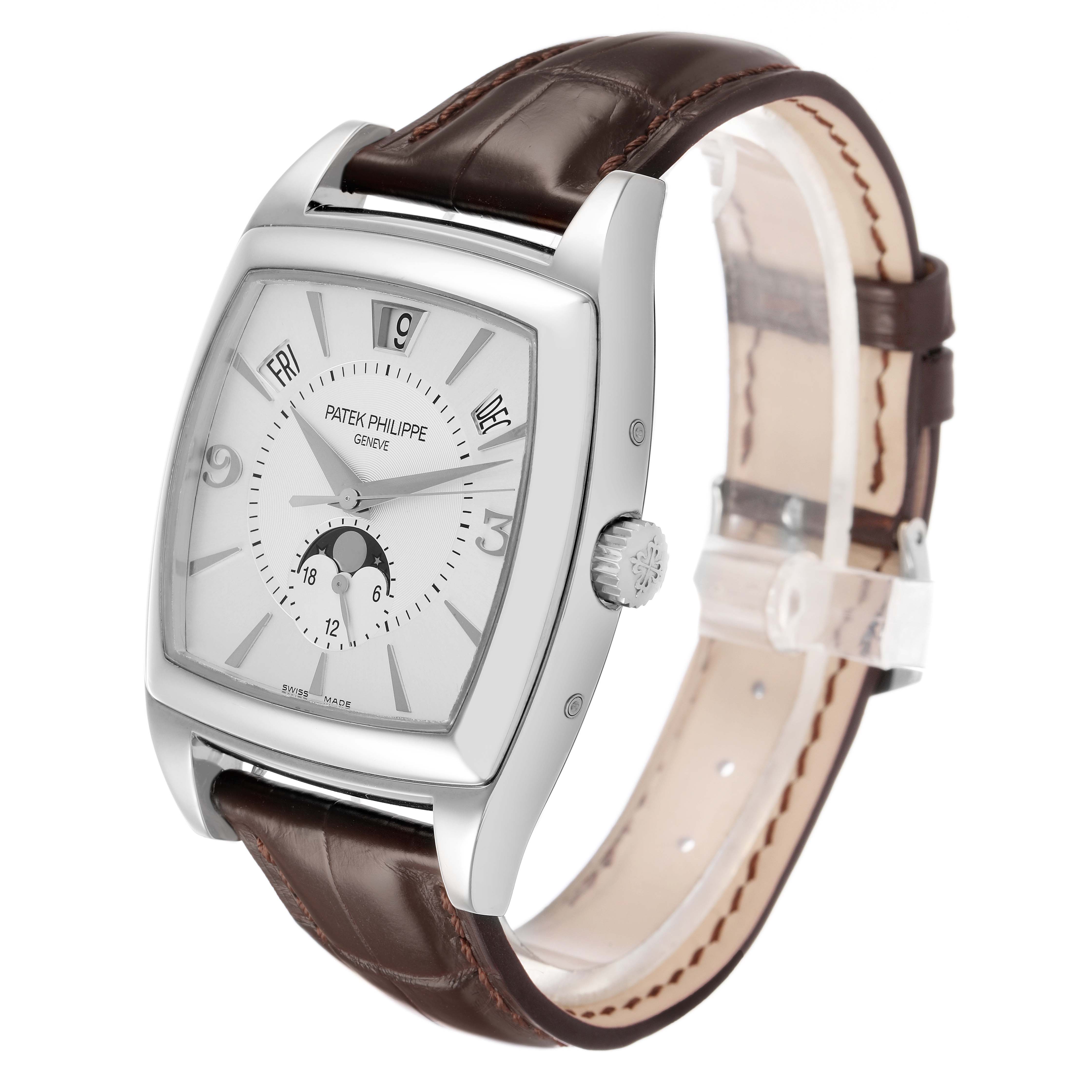 The Patek Philippe Gondolo 5135G-001 Men's White Gold Silver Dial watch is shown at a three-quarter angle, highlighting its dial, case, crown, and leather strap.