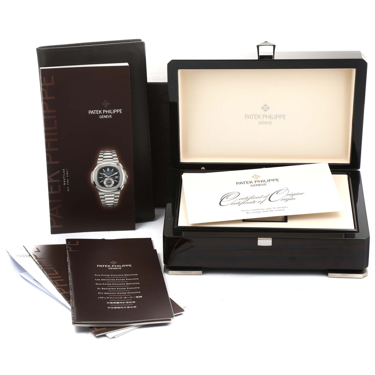 The image shows the packaging and documentation for the Patek Philippe Nautilus 5980/1A Men's Stainless Steel White Dial 5980/1A Men's Stainless Steel White Dial model, including the box and booklets.
