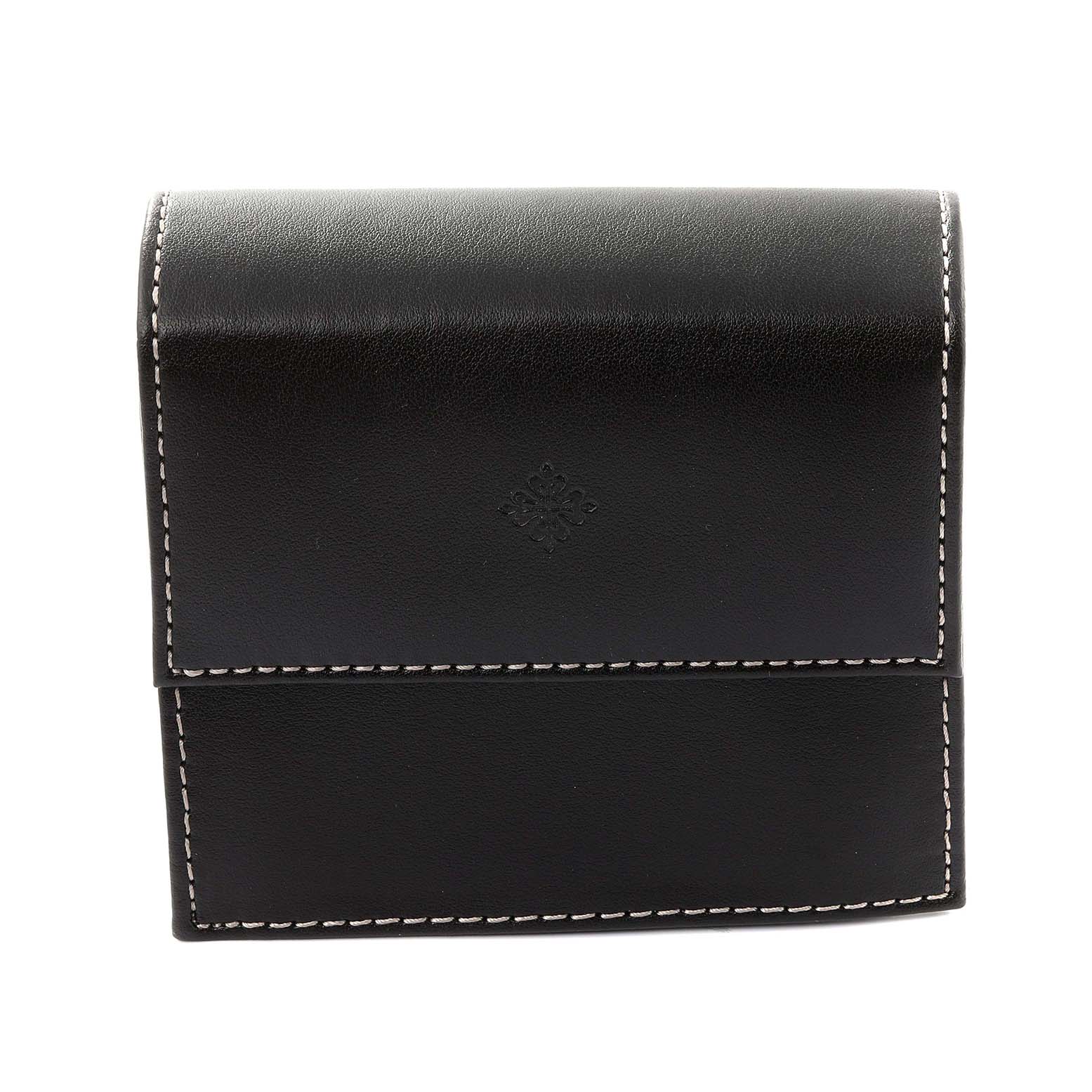 This image shows a closed, black leather case for the Patek Philippe Twenty-4 4910 Women's Stainless Steel Silver Dial 4910 Women's Stainless Steel Silver Dial watch, with visible stitching and the brand's emblem embossed on it.