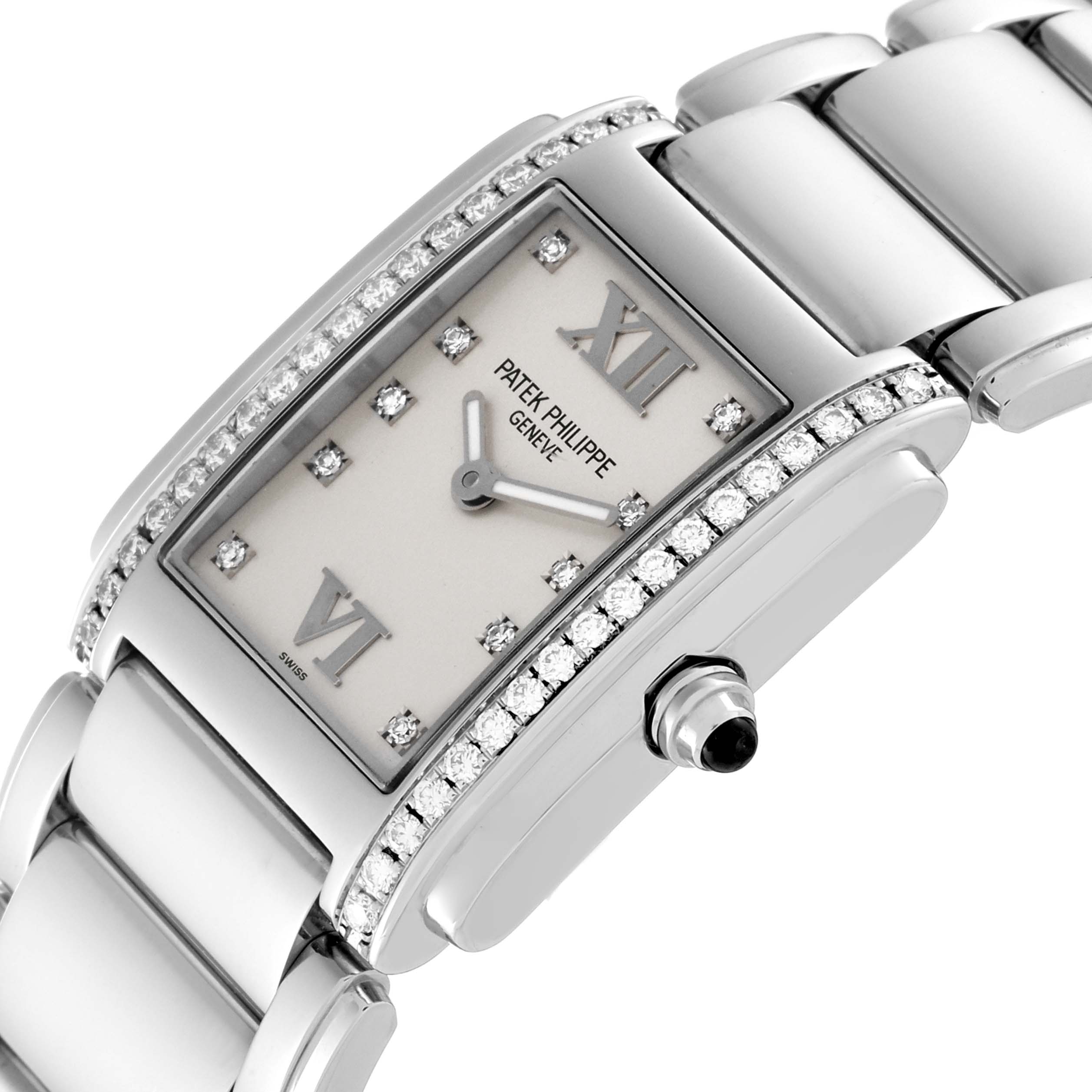 The photo shows a close-up view of the dial, crown, and part of the bracelet of the Patek Philippe Twenty-4 4910 Women's Stainless Steel Silver Dial 4910 Women's Stainless Steel Silver Dial model watch.