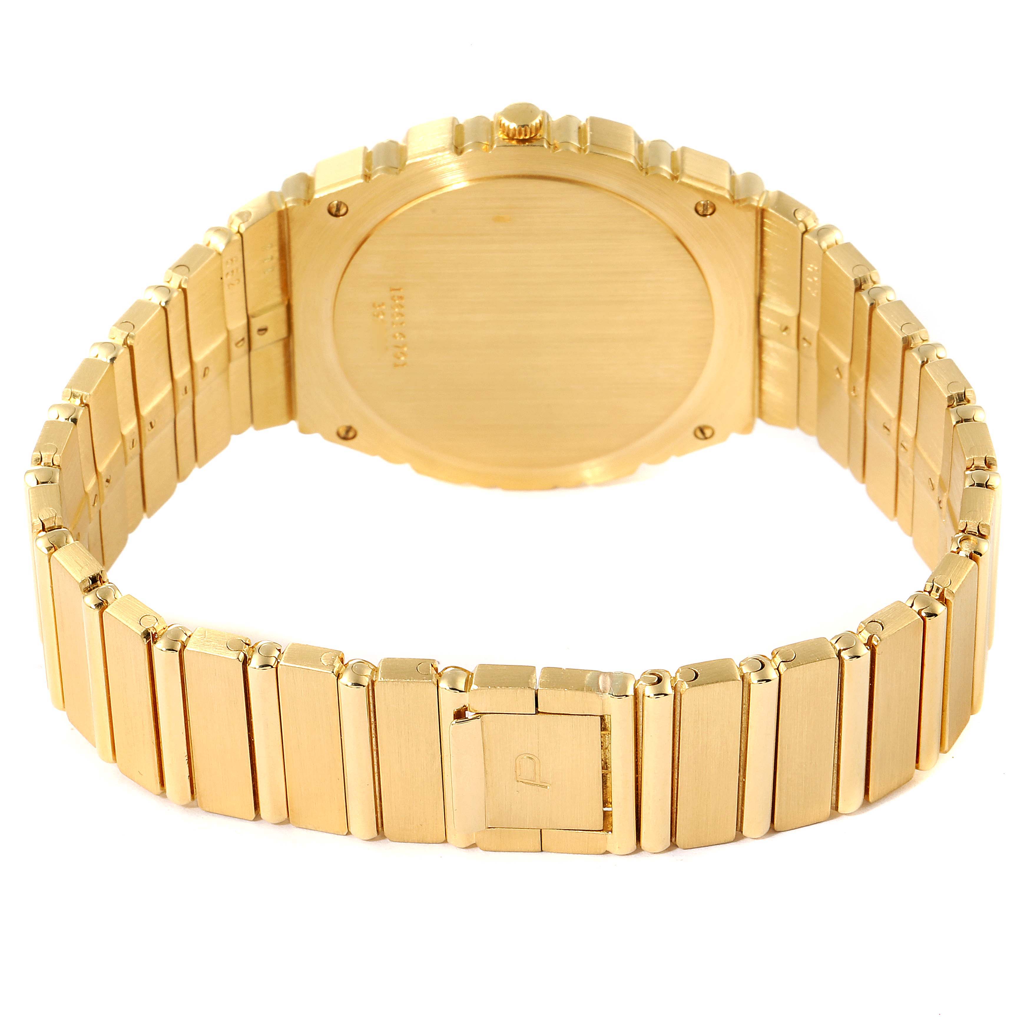 The image shows the back case and gold bracelet of the Piaget 15661C701 Men's Yellow Gold Champagne Dial 15661C701 Men's Yellow Gold Champagne Dial Polo 18K Yellow Gold Champagne Dial Men's Watch 15561 model.