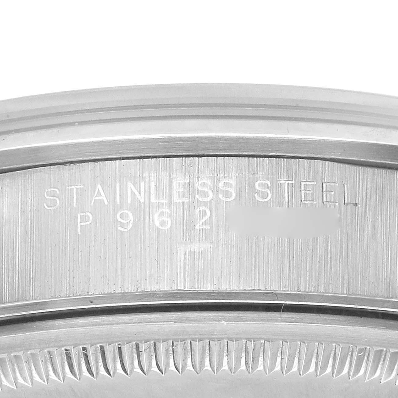 The image shows the stainless steel case back with engraved details of a Rolex Air-King 14000 Men's Stainless Steel Silver Dial watch.