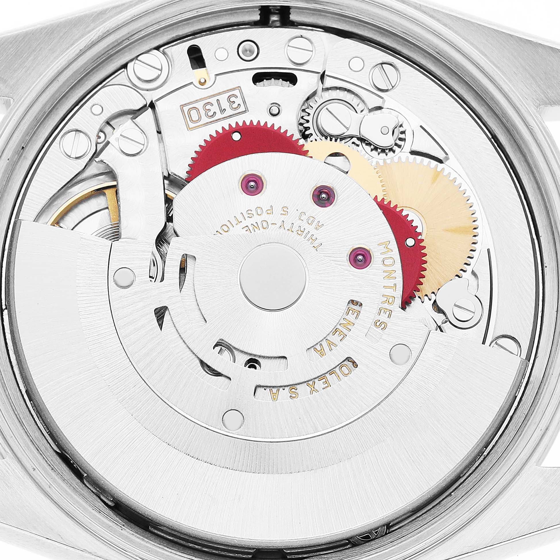 The image shows a close-up of the Rolex Air-King 14000 Men's Stainless Steel Pink Dial's movement mechanism from the back, highlighting gears and inscriptions.