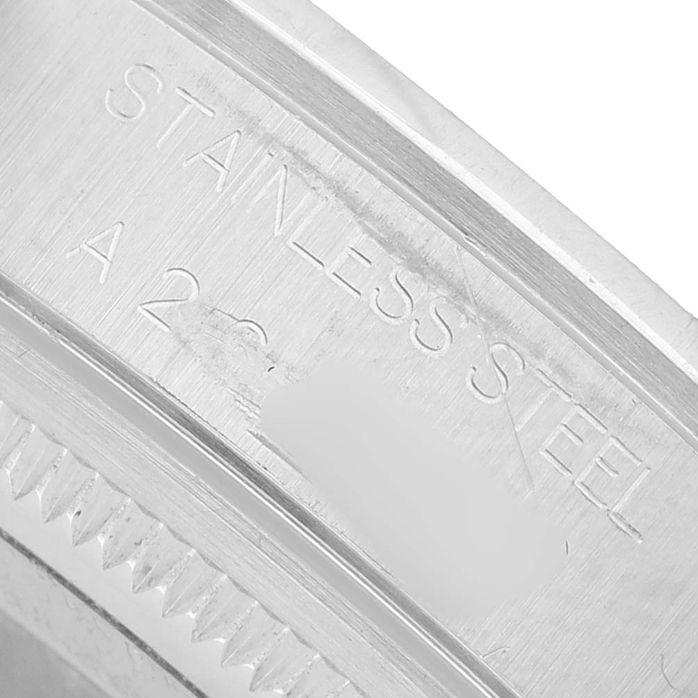 The image shows a close-up of the inner case engraving on the Rolex Air-King 14000 Men's Stainless Steel Pink Dial, highlighting the material "stainless steel."