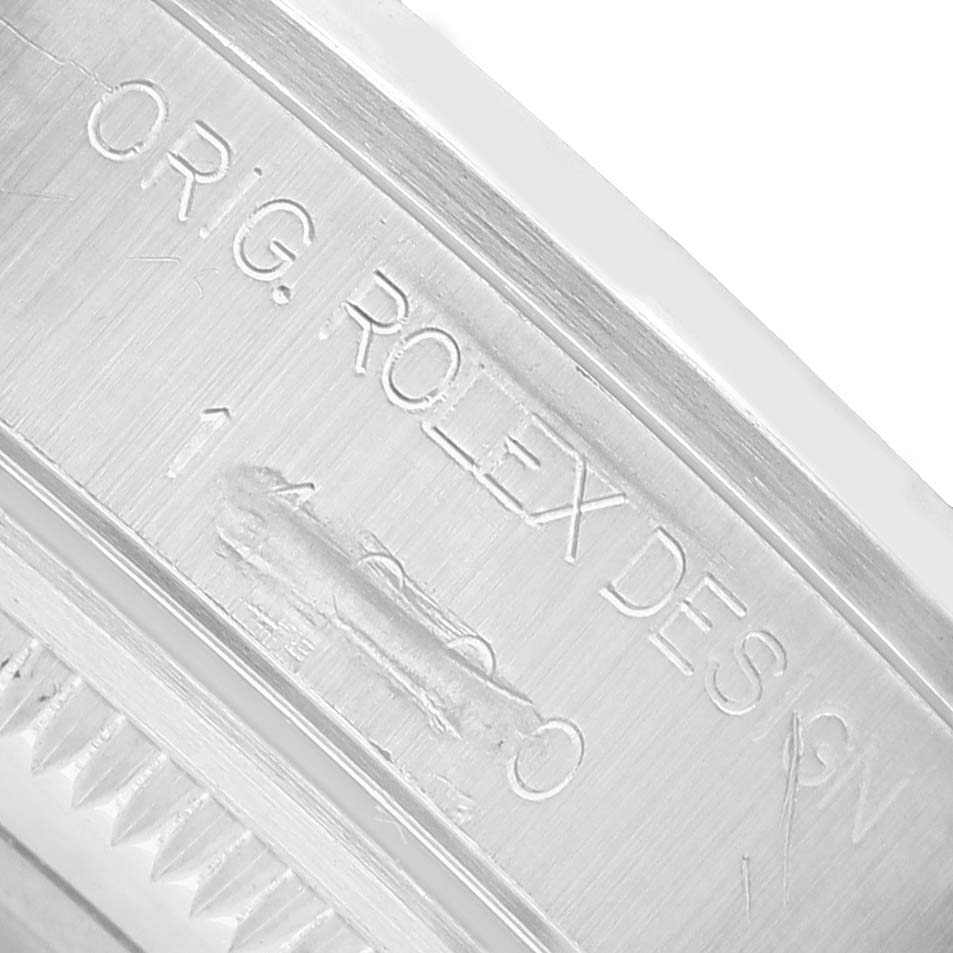 The image shows a close-up of the engraved inner case of a Rolex Air-King 14000 Men's Stainless Steel Pink Dial, displaying "ORIG. ROLEX DESIGN."