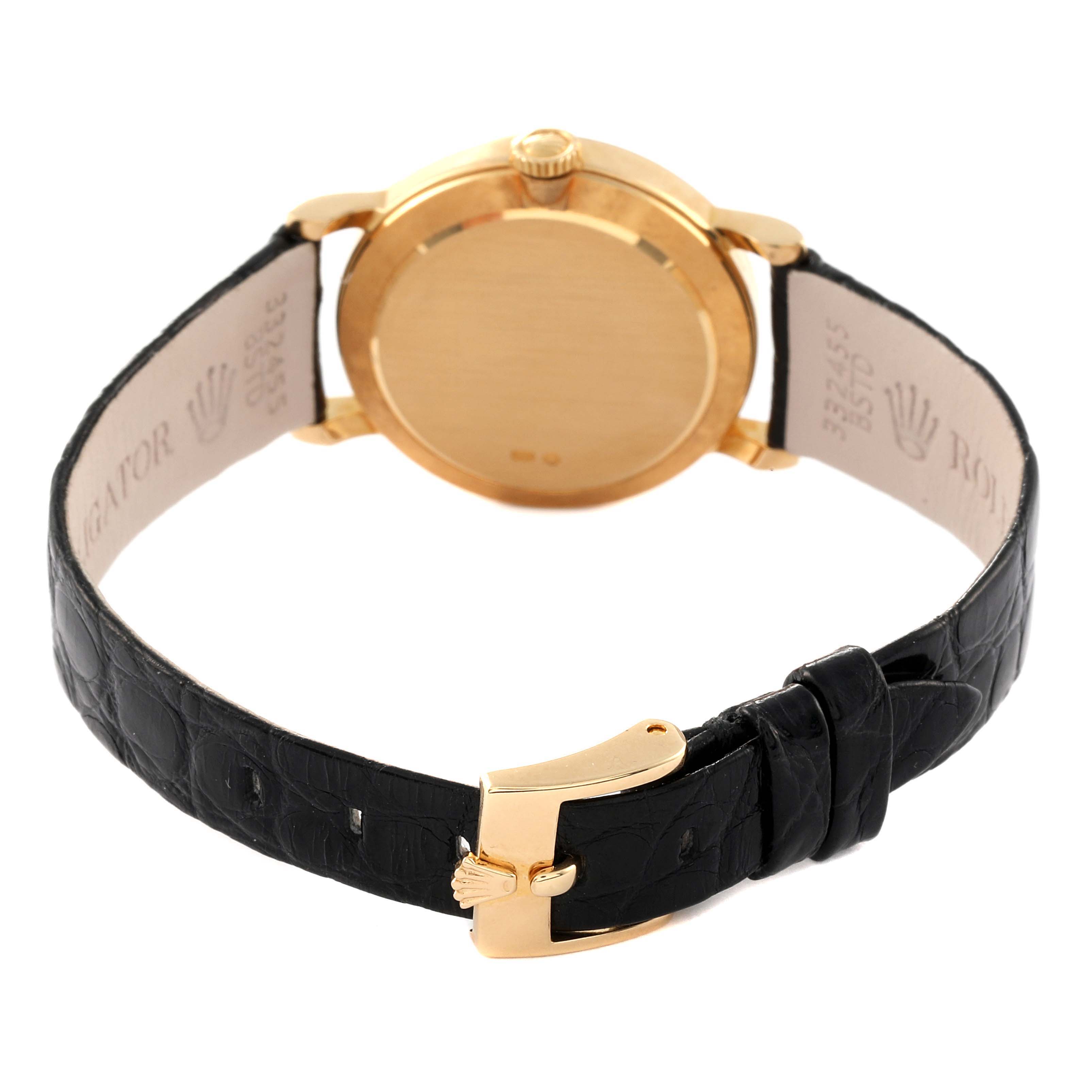 The Rolex Cellini 5109 Women's Yellow Gold Mother of Pearl Dial 5109 Women's Yellow Gold Mother of Pearl Dial watch is shown from the back, highlighting its gold case and black leather strap with a gold buckle.