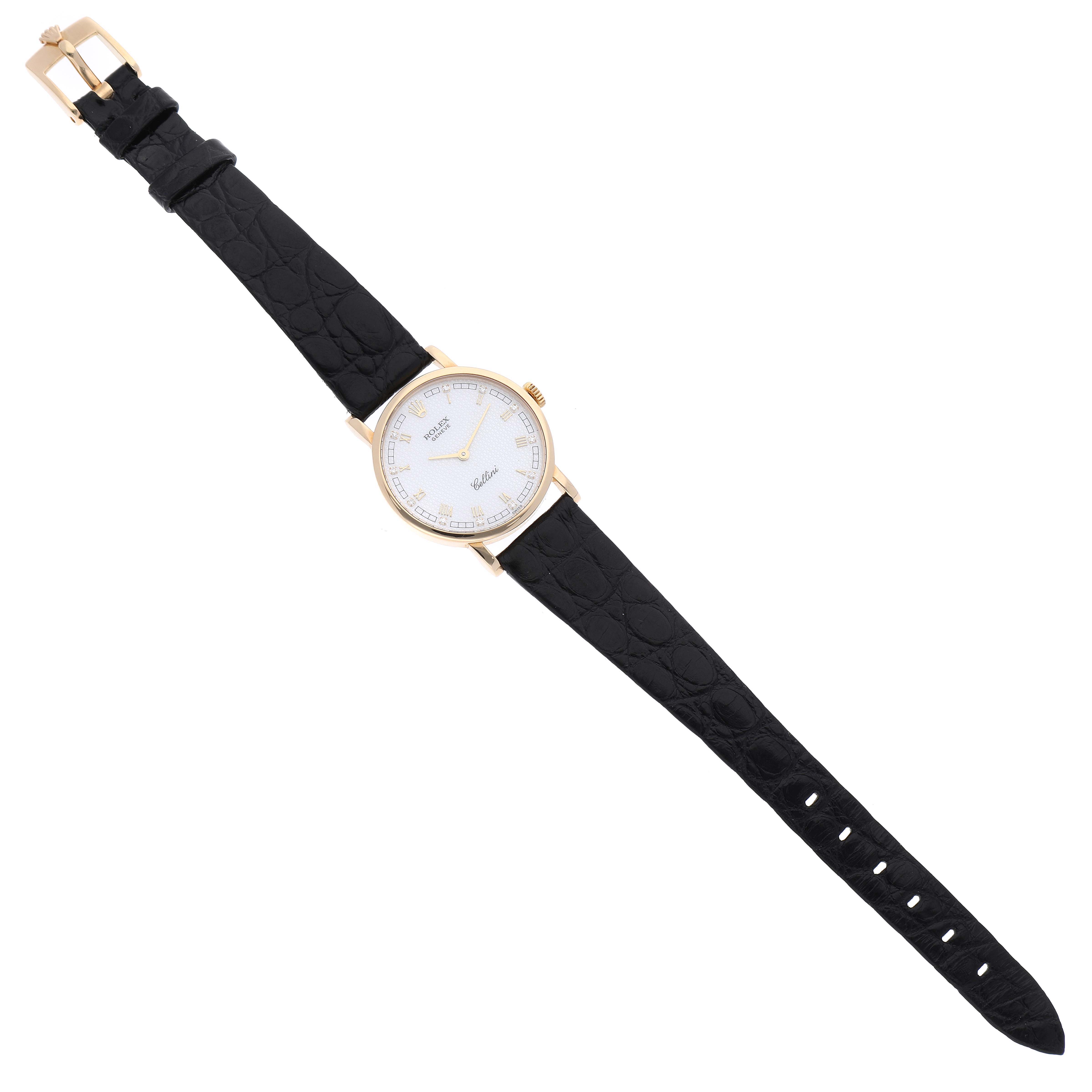 The Rolex Cellini 5109 Women's Yellow Gold Mother of Pearl Dial 5109 Women's Yellow Gold Mother of Pearl Dial watch is shown from a top-down angle, displaying its face, black leather strap, and gold buckle.