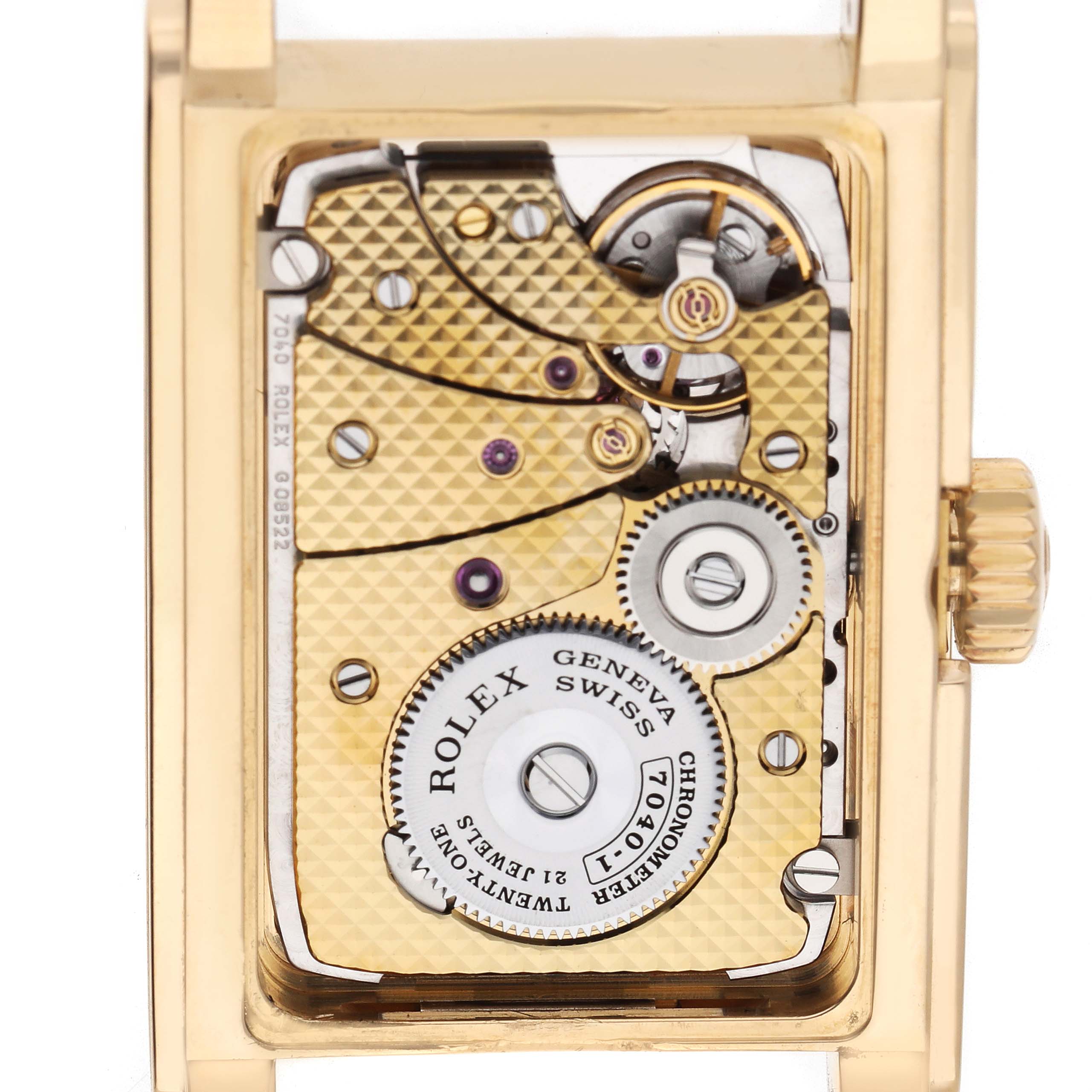 The image shows the intricate movement of a Rolex Cellini 5440 Men's Yellow Gold Champagne Dial watch from the back, highlighting its mechanical components.
