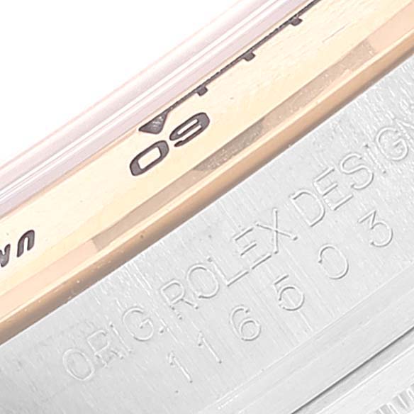 This image shows a close-up of the bezel and engraved design details of a Rolex Daytona 116503 Men
s Steel and Gold (two tone) Champagne Dial 116503 Men
s Steel and Gold (two tone) Champagne Dial watch.