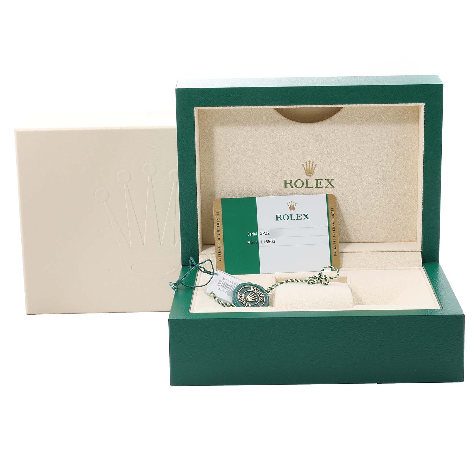 The image shows the open box of a Rolex Daytona 116503 Men
s Steel and Gold (two tone) Champagne Dial 116503 Men
s Steel and Gold (two tone) Champagne Dial watch, revealing its empty interior, warranty card, and tags.